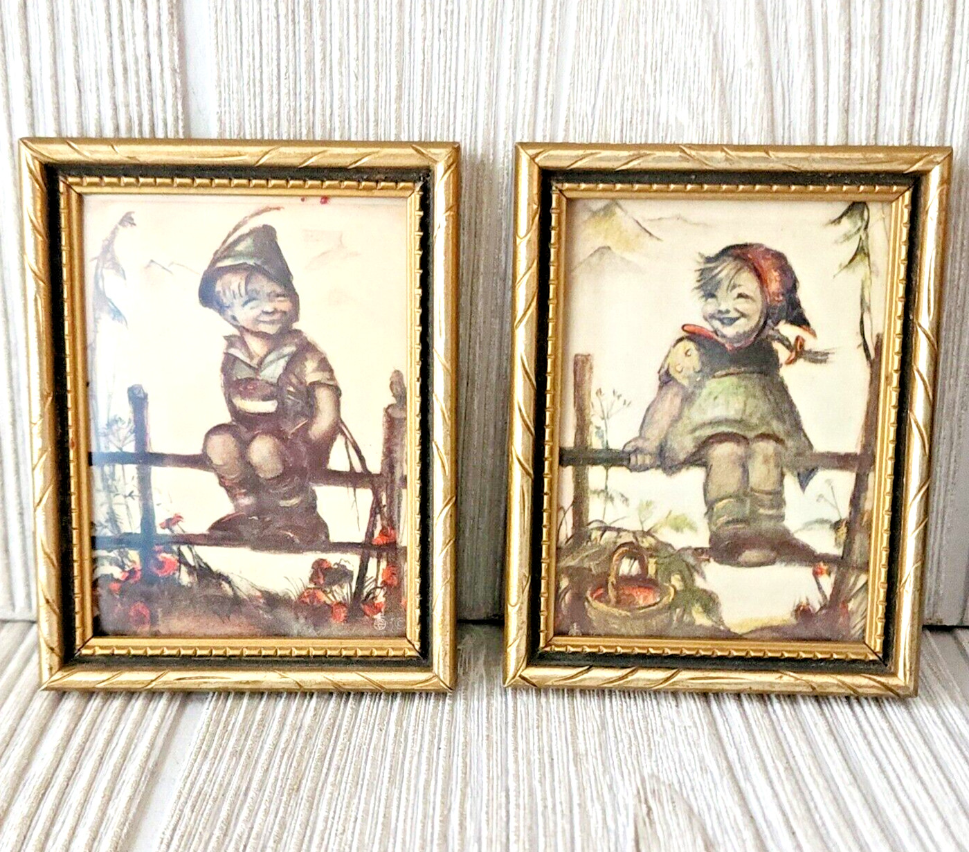 2 Vintage HUMMEL pictures Boy On Fence And Girl On Fence Approx. 3.5″ x 3″