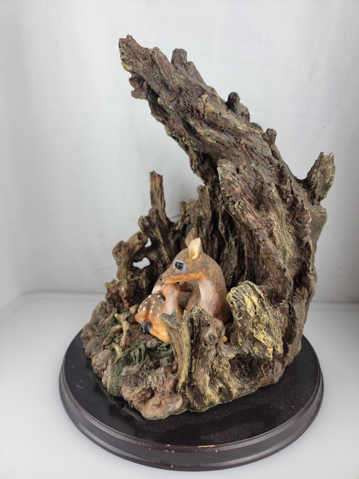12″ Masterpiece Resin Deer, Fawn Resting Cave/ Tree Trunk Wodeen Base