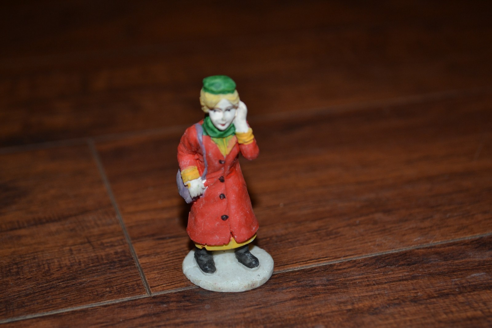 E18- approx. 2.5″ Woman w/ Coat, Hat & Purse