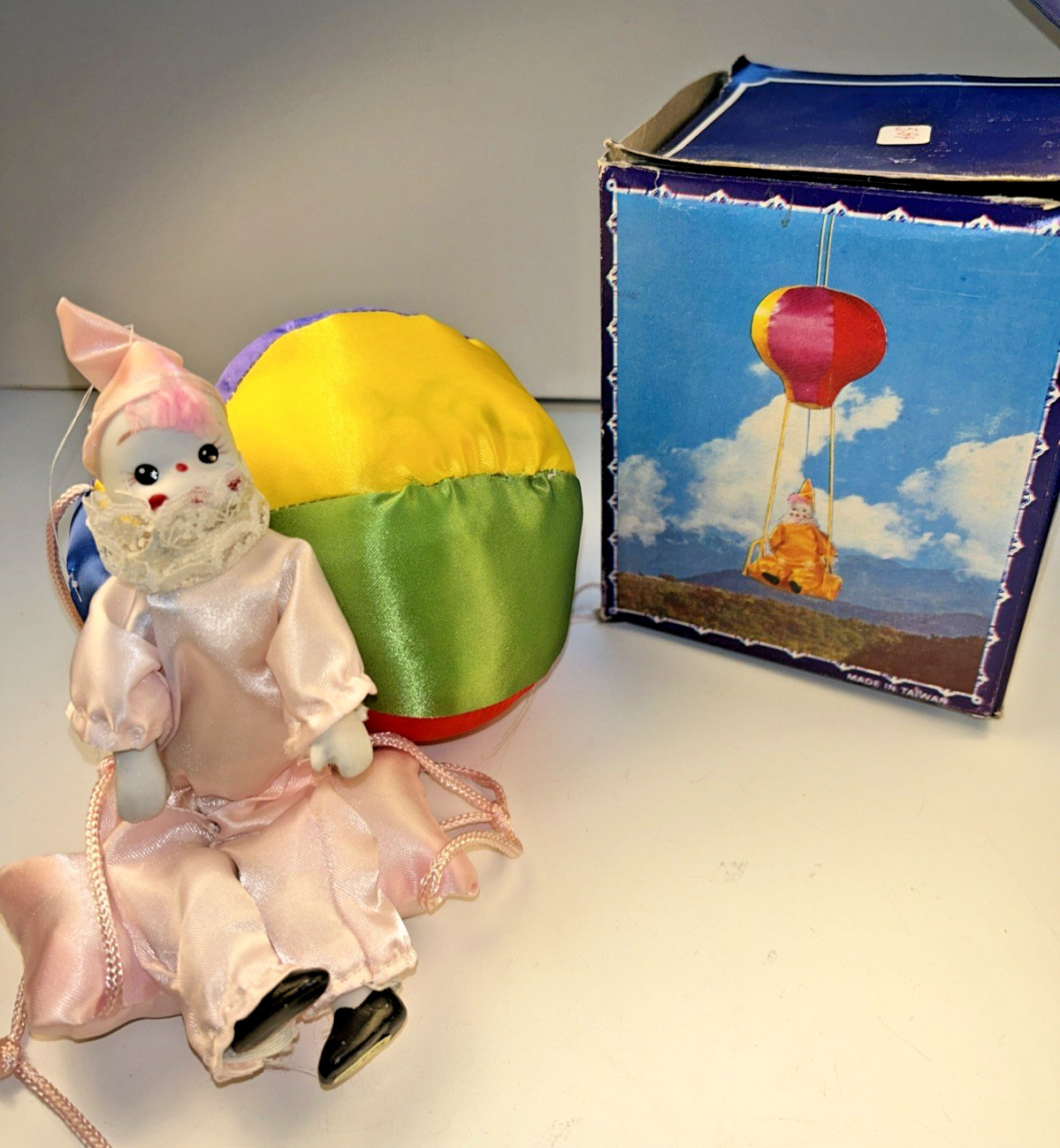 1980s Vtg Porcelain Clown Swinging from a Satin Balloon Rainbow Pink Clown
