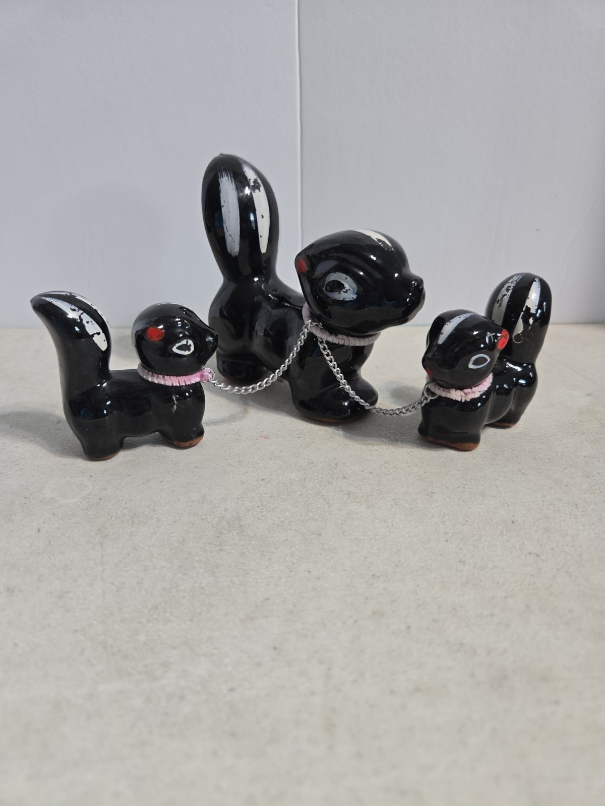 MCM Made In Japan Ceramic Or Porcelain Mother Skunk & Two Baby Skunk Figurines