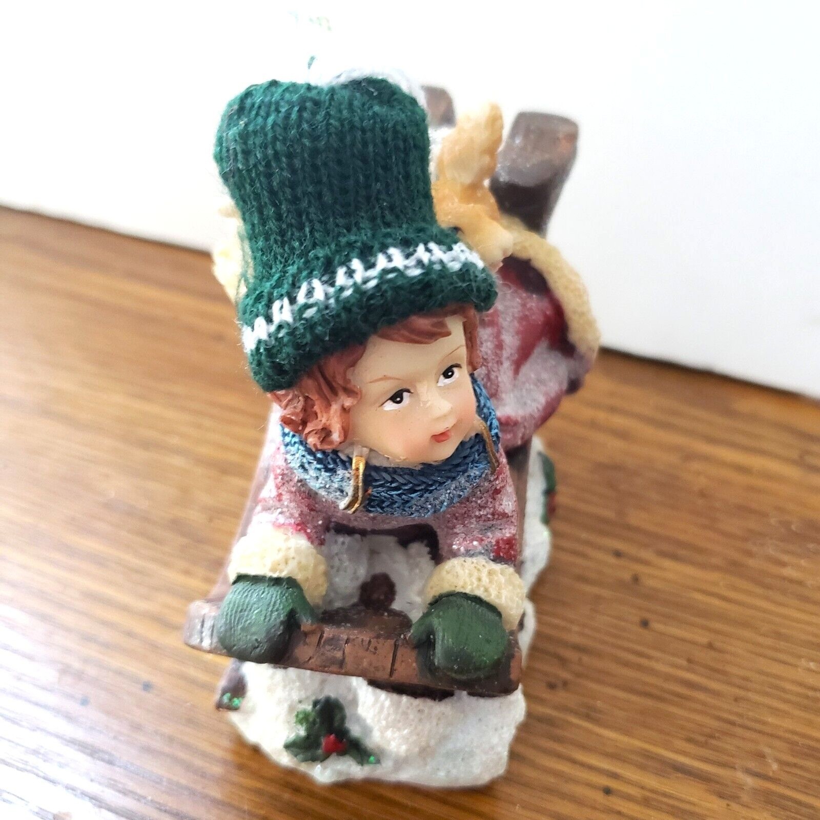 Girl Sledding with Squirrel Resin Figurine with a Real Knitted Stocking Cap