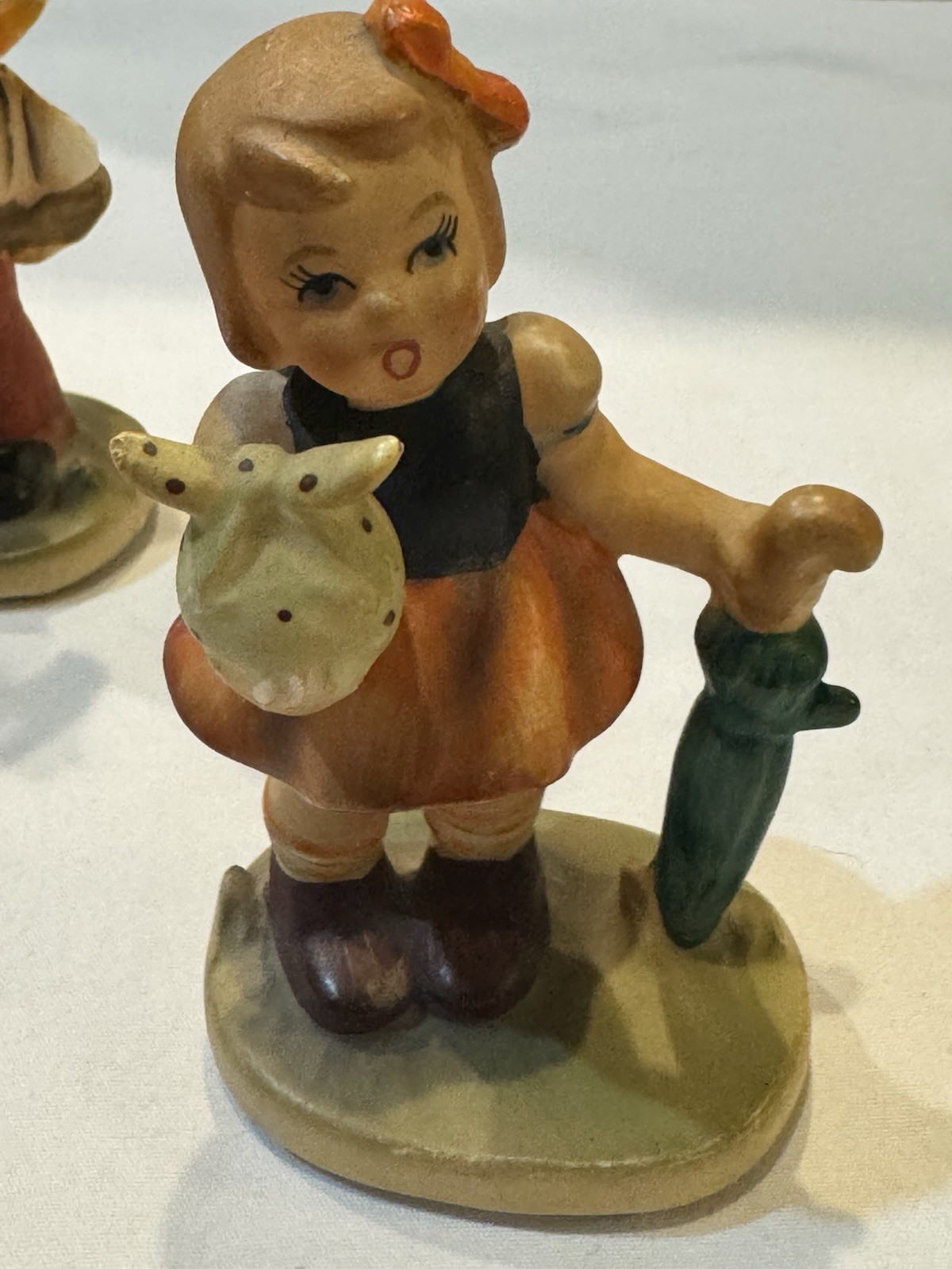 VNTG Lot of 4 Napcoware Porcelain Figurines- Bowling, Sailboat, Flute, Umbrella