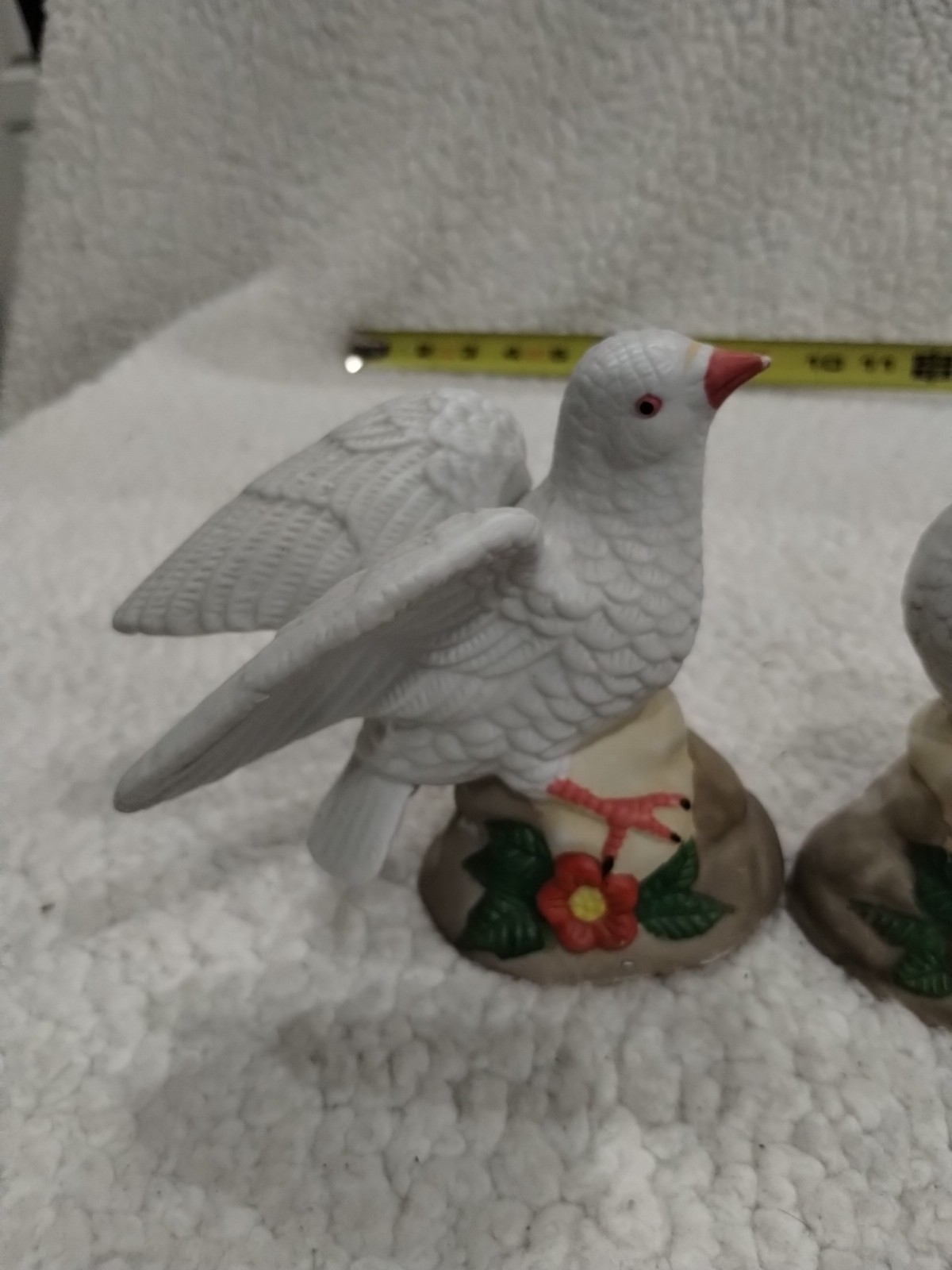 Two Ceramic Doves Wings Back With Red And Green Flowers.