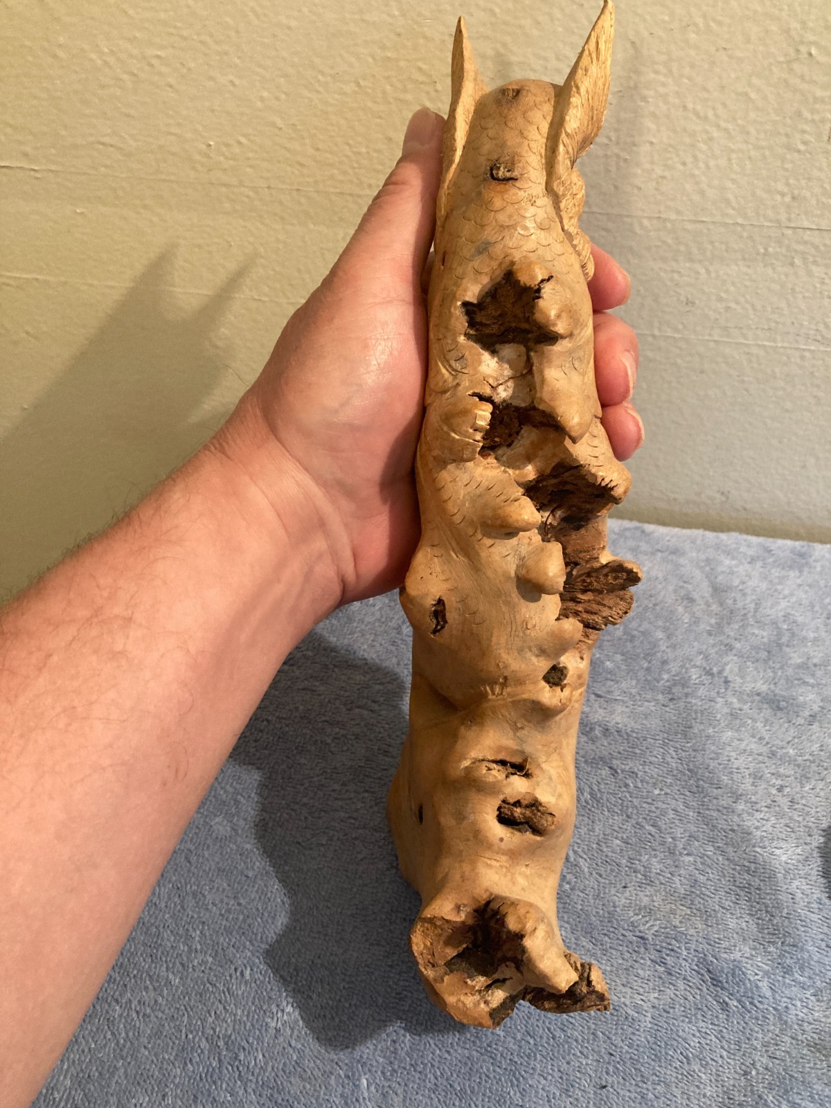 Owl bird statue hand carved from yellow natural wood with natural wood cracks