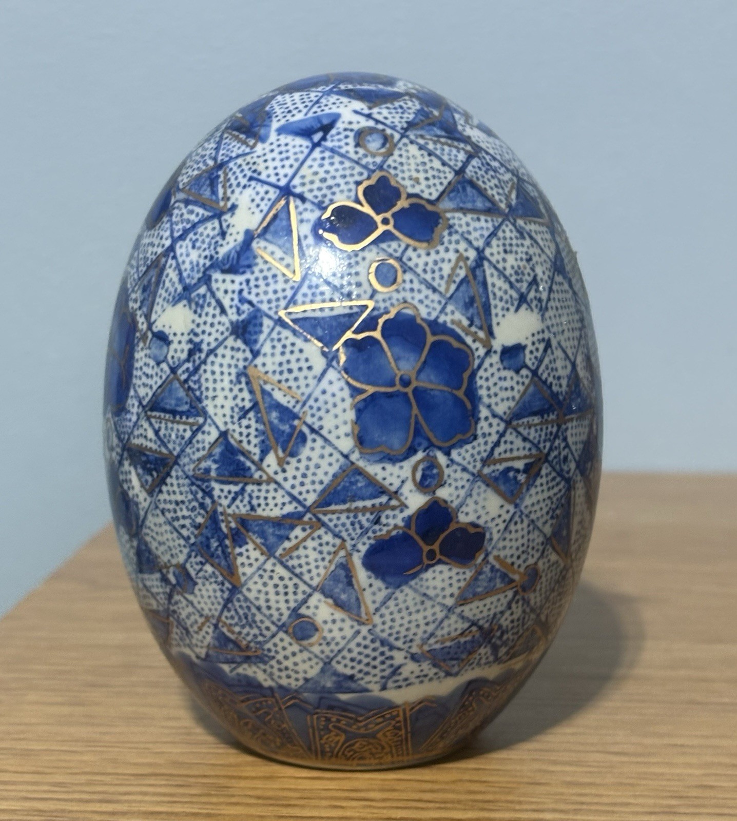Decorative Porcelain Or Ceramic Egg with Geometric Shapes And Gold Accents