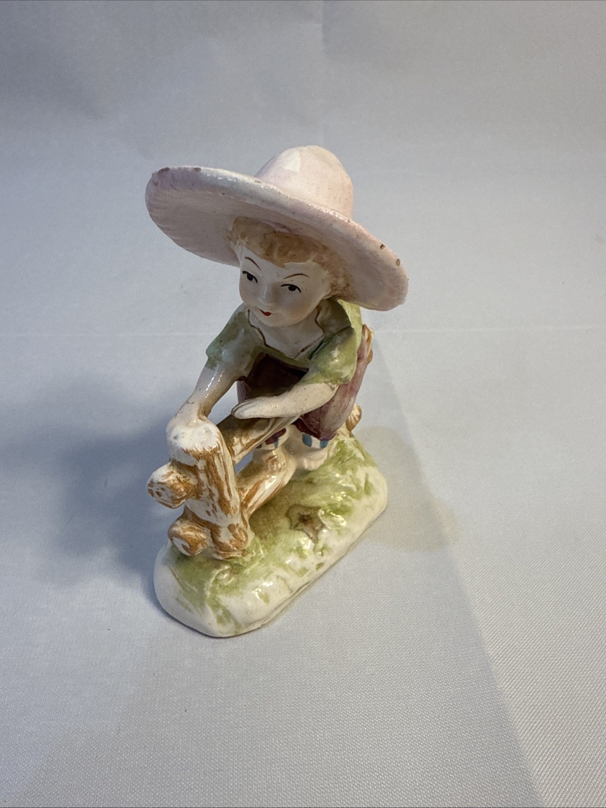 VTG Girl Figurine on a Fence Line