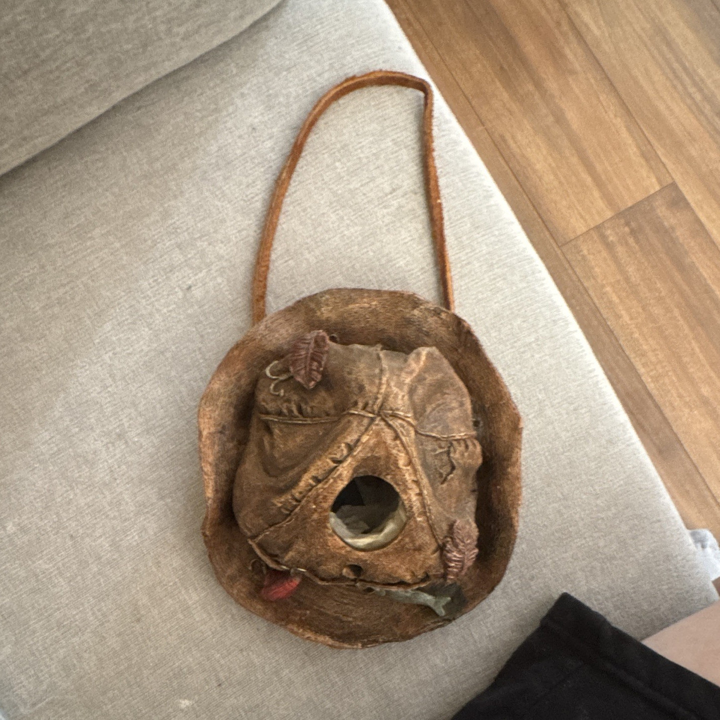 Birdhouse styled to resemble a rustic, decorative fishing hat & boot