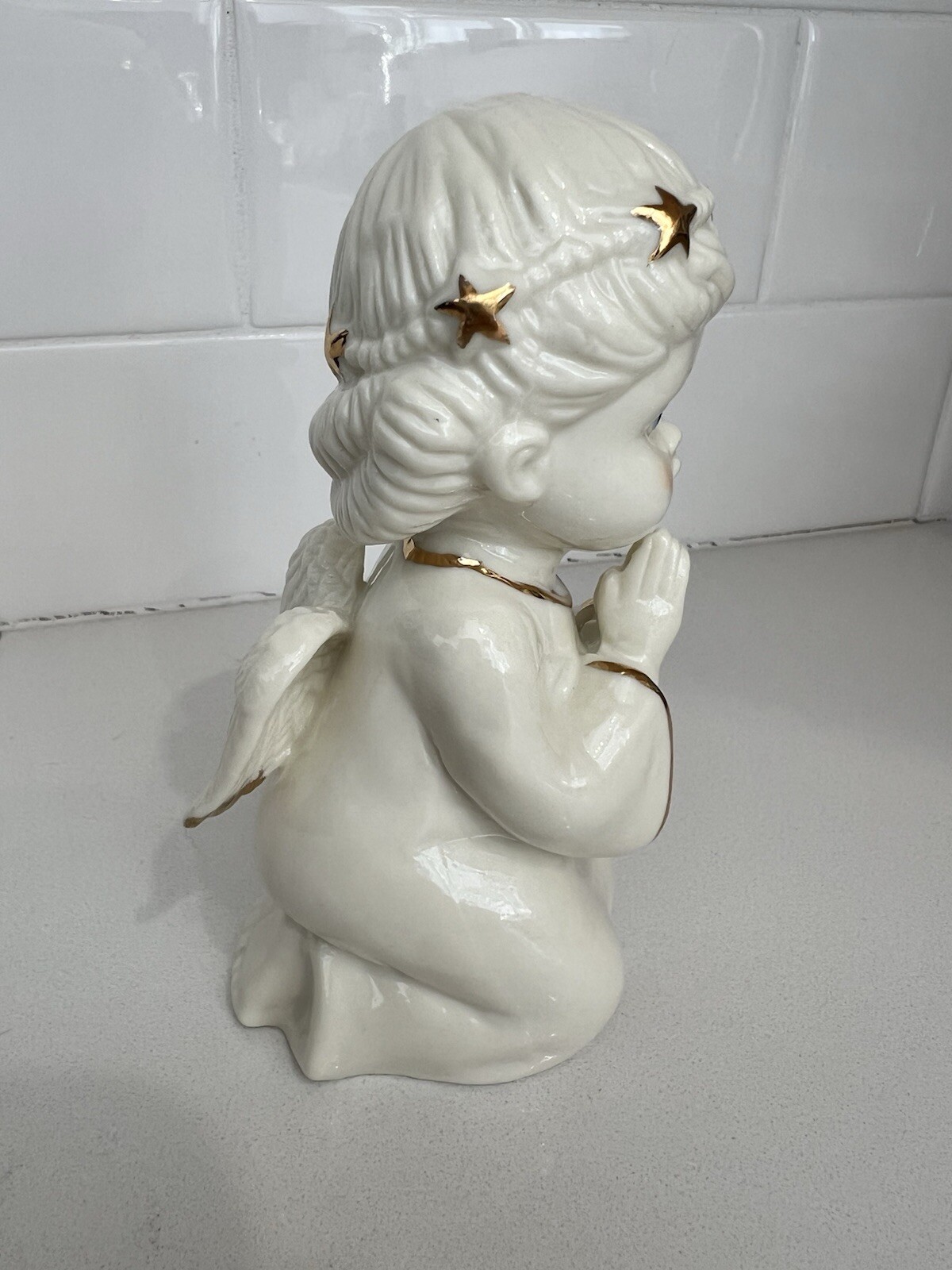 Praying And Kneeling Angel White Ceramic With Gold Accents.