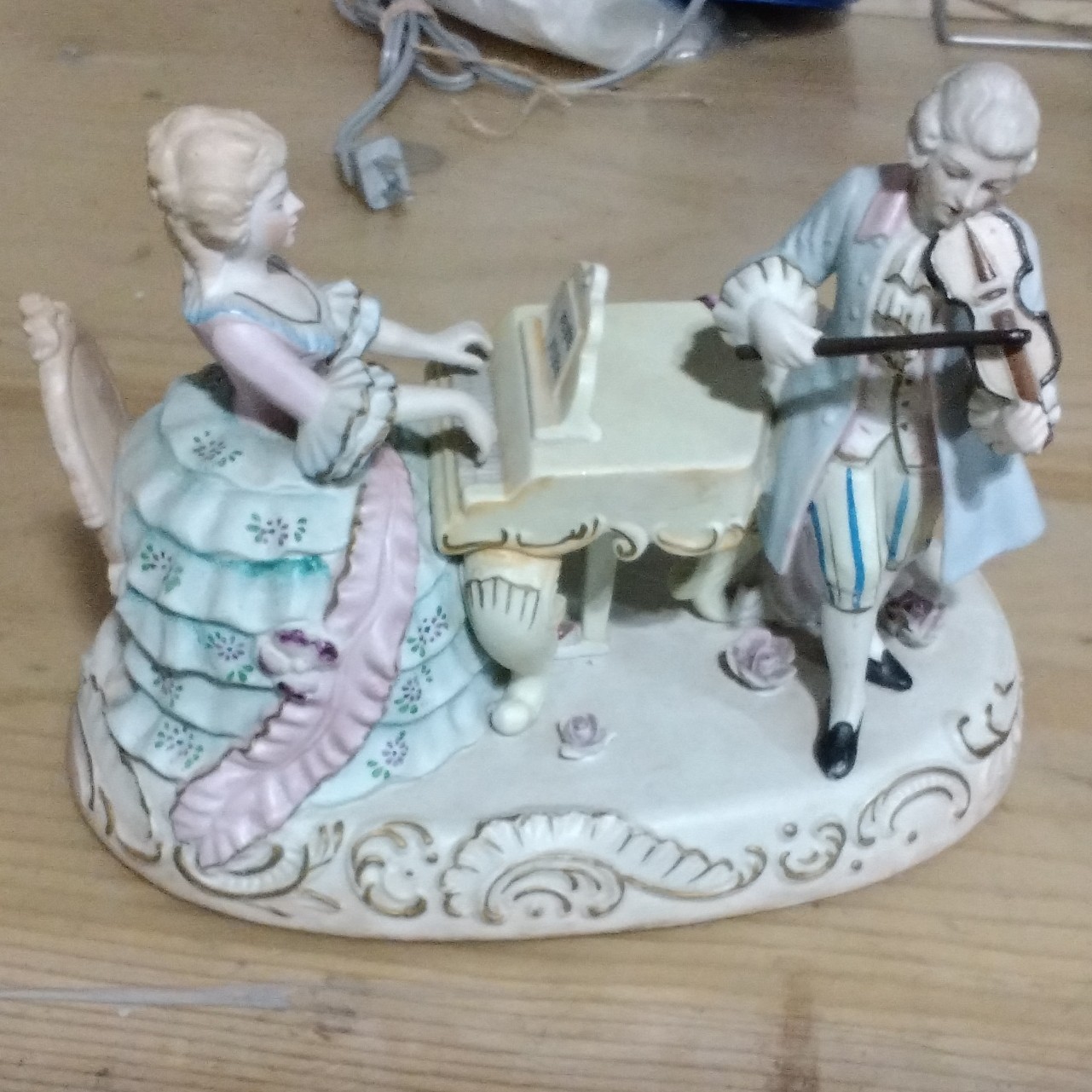 Hand painted bisque figurine couple playing music
