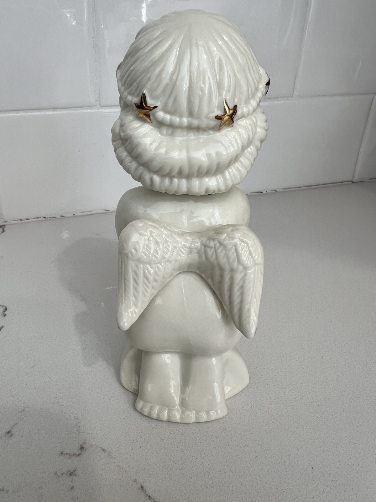 Praying And Kneeling Angel White Ceramic With Gold Accents.