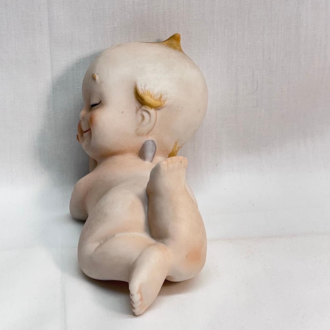 VINTAGE Porcelain Kewpie Winking Doll Figurine 2 in W x 5 in L x 3 1/2 in H