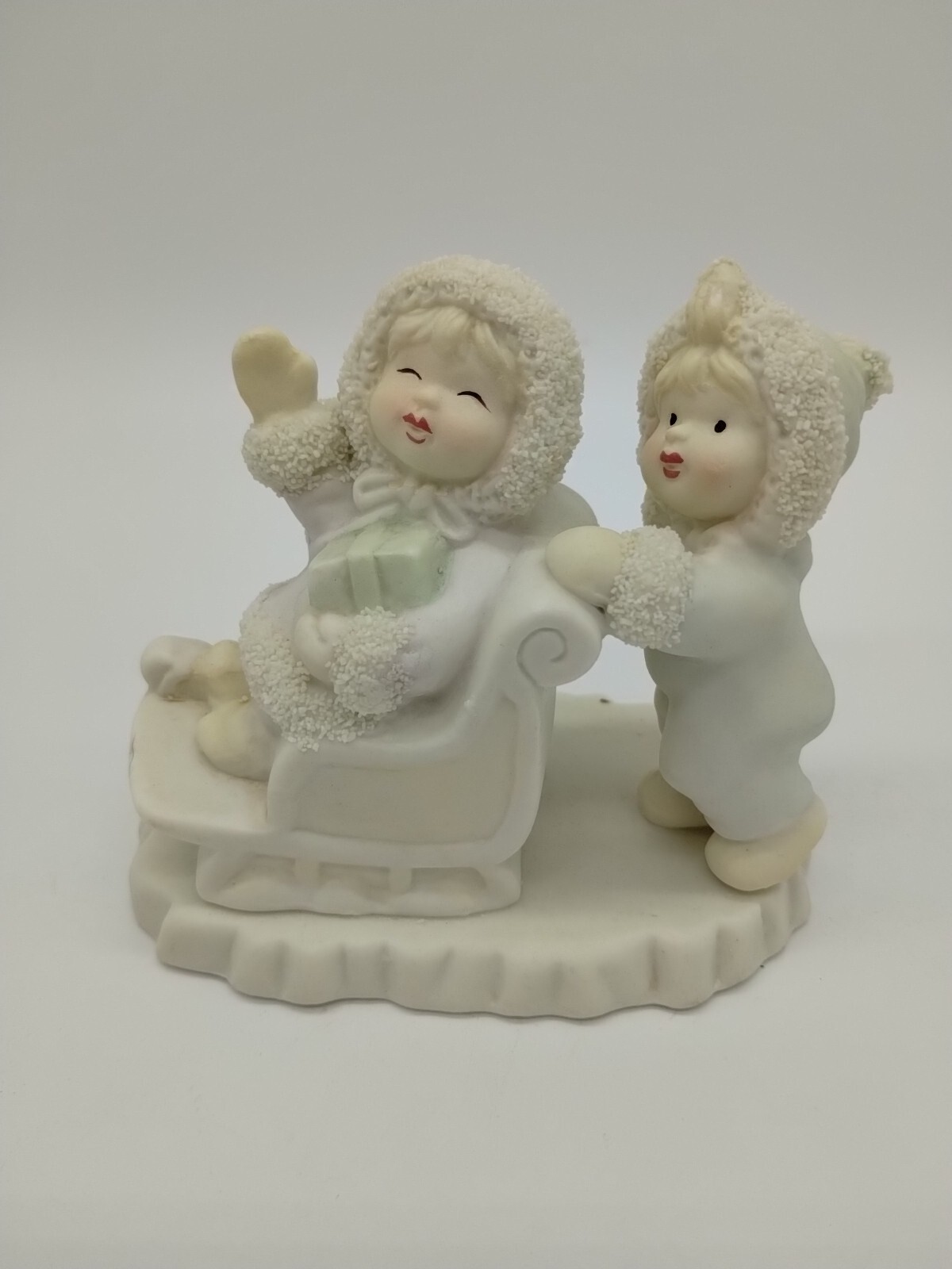 Small Porcelain Figurine Christmas Girls Sledding Gift 3.25 Inches Tall Textured