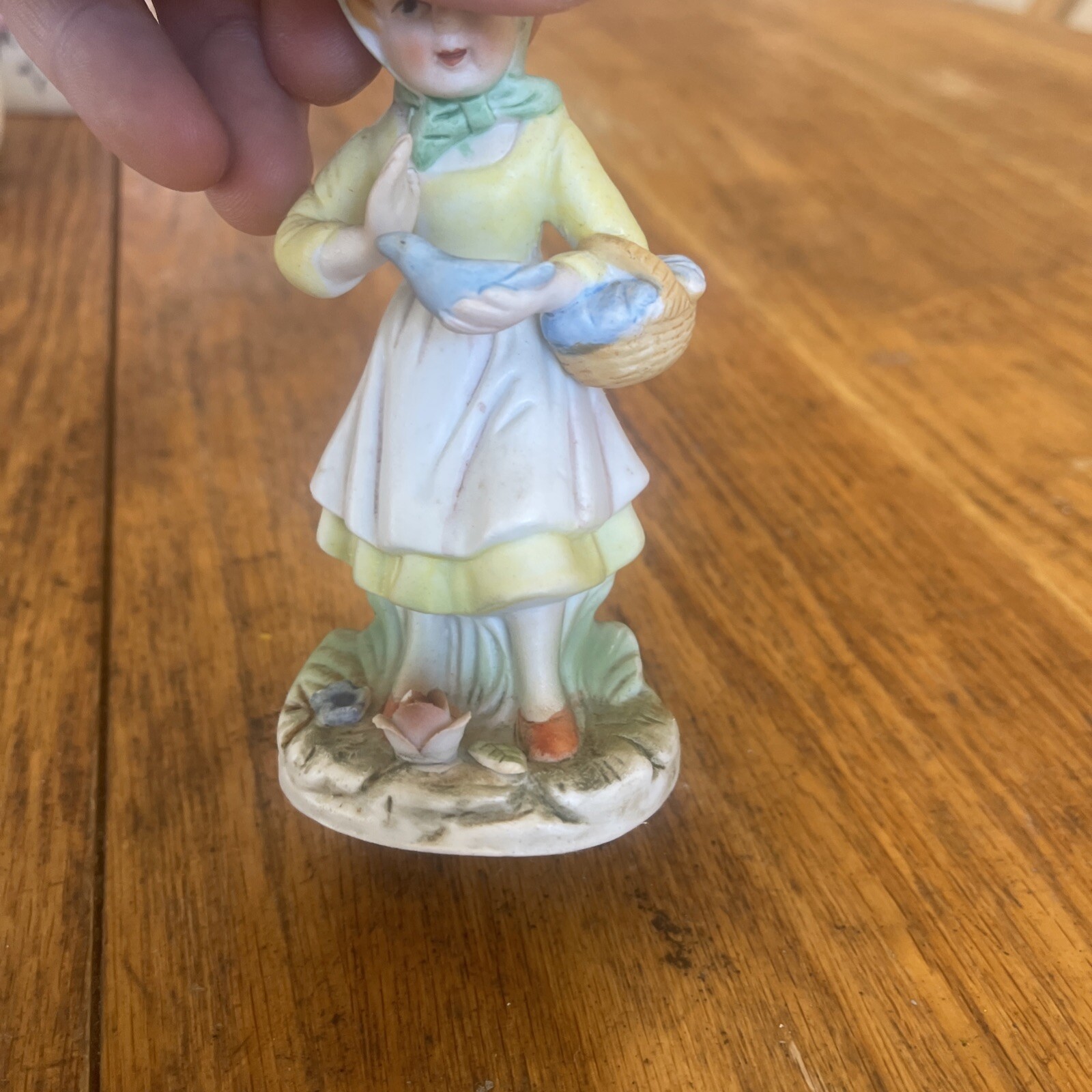 Porcelain Figurine Woman Holding Basket With Bird In Hand Flowers On Base
