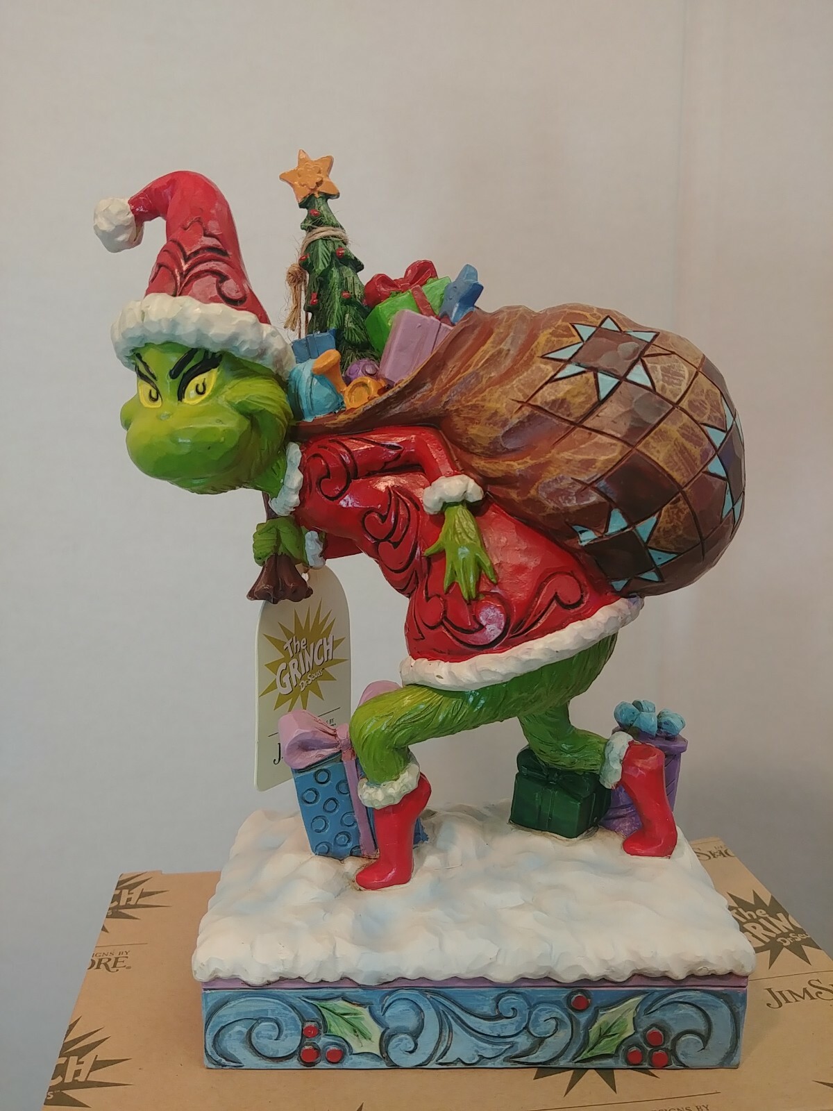 Dr. Seuss Grinch by Jim Shore Grinch Tip Toeing with Bag of Gifts 7.7″ Figurine