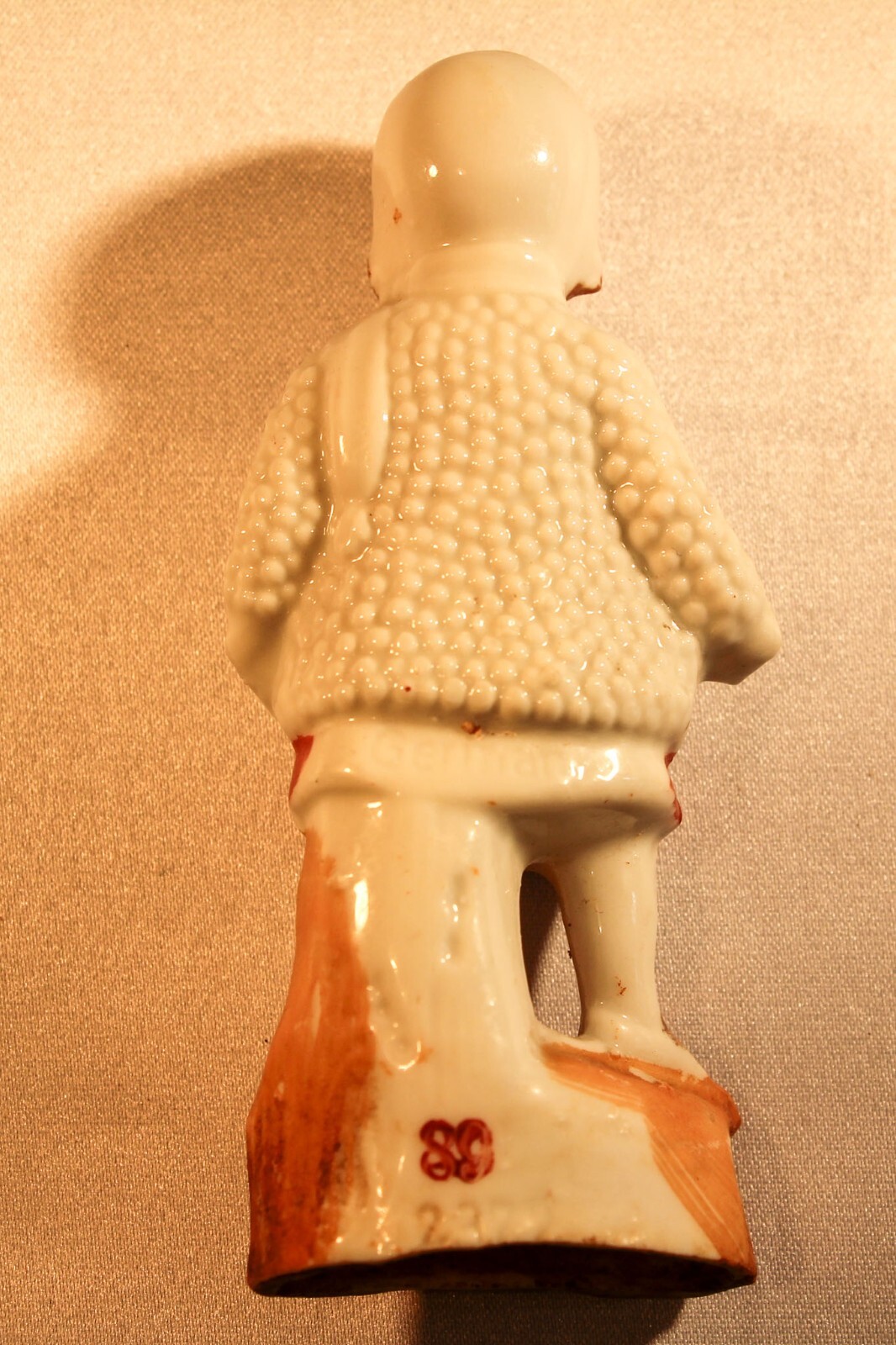 vintage Girl in knit coat porcelain figurine 3.75″ Germany