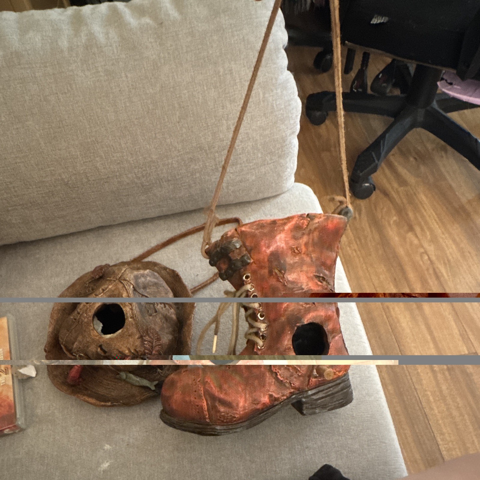 Birdhouse styled to resemble a rustic, decorative fishing hat & boot