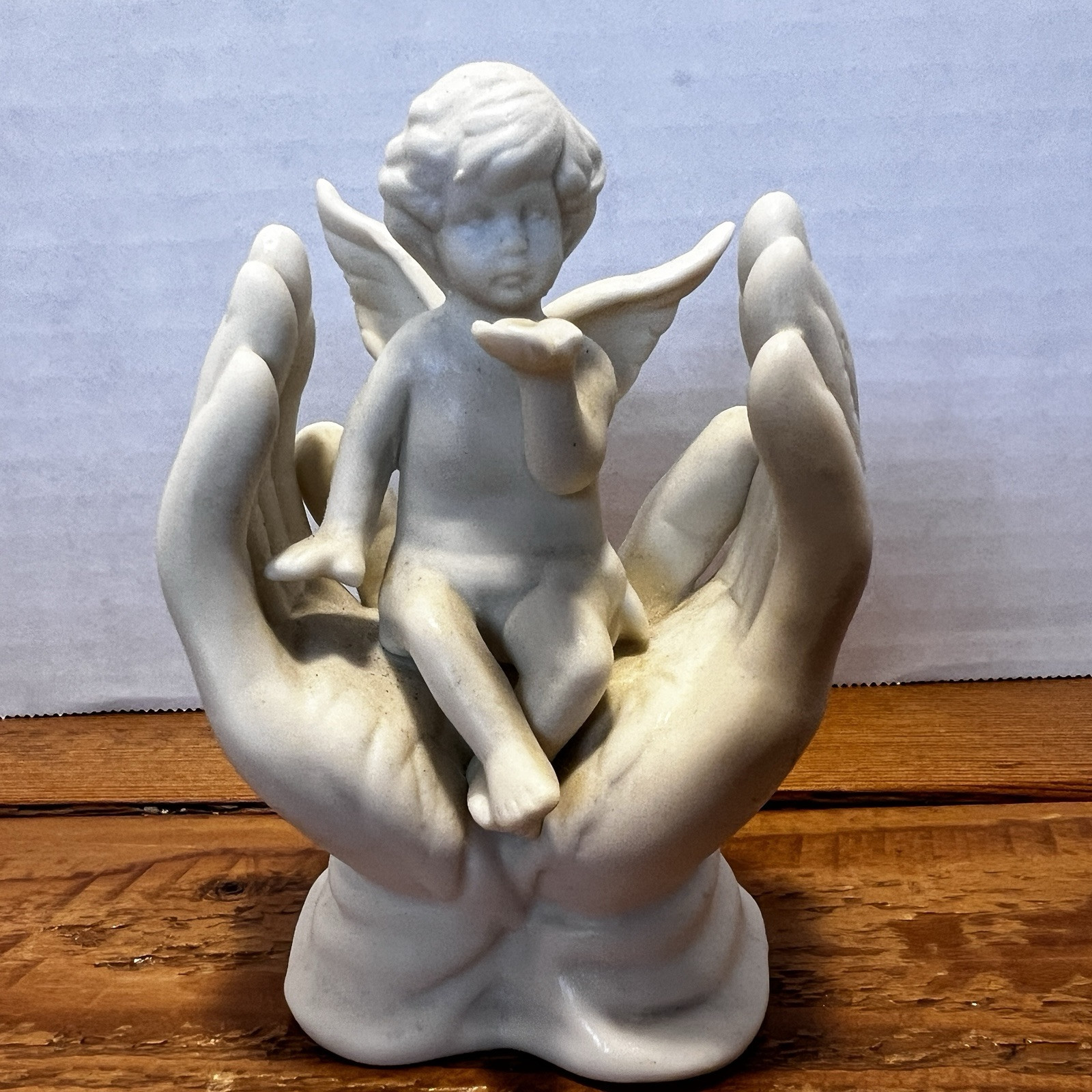 Vintage White Porcelain Figurine~Cherub Angel Sitting in Praying Hands~BEAUTIFUL