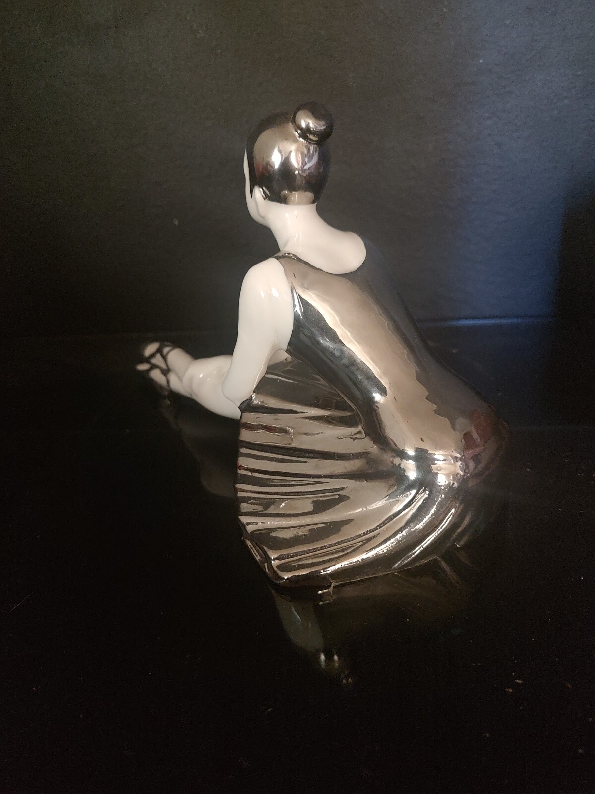 WHITE AND SILVER PORCELAIN SITTING BALLERINA FIGURINE. 9″L x 6″H X 5″W