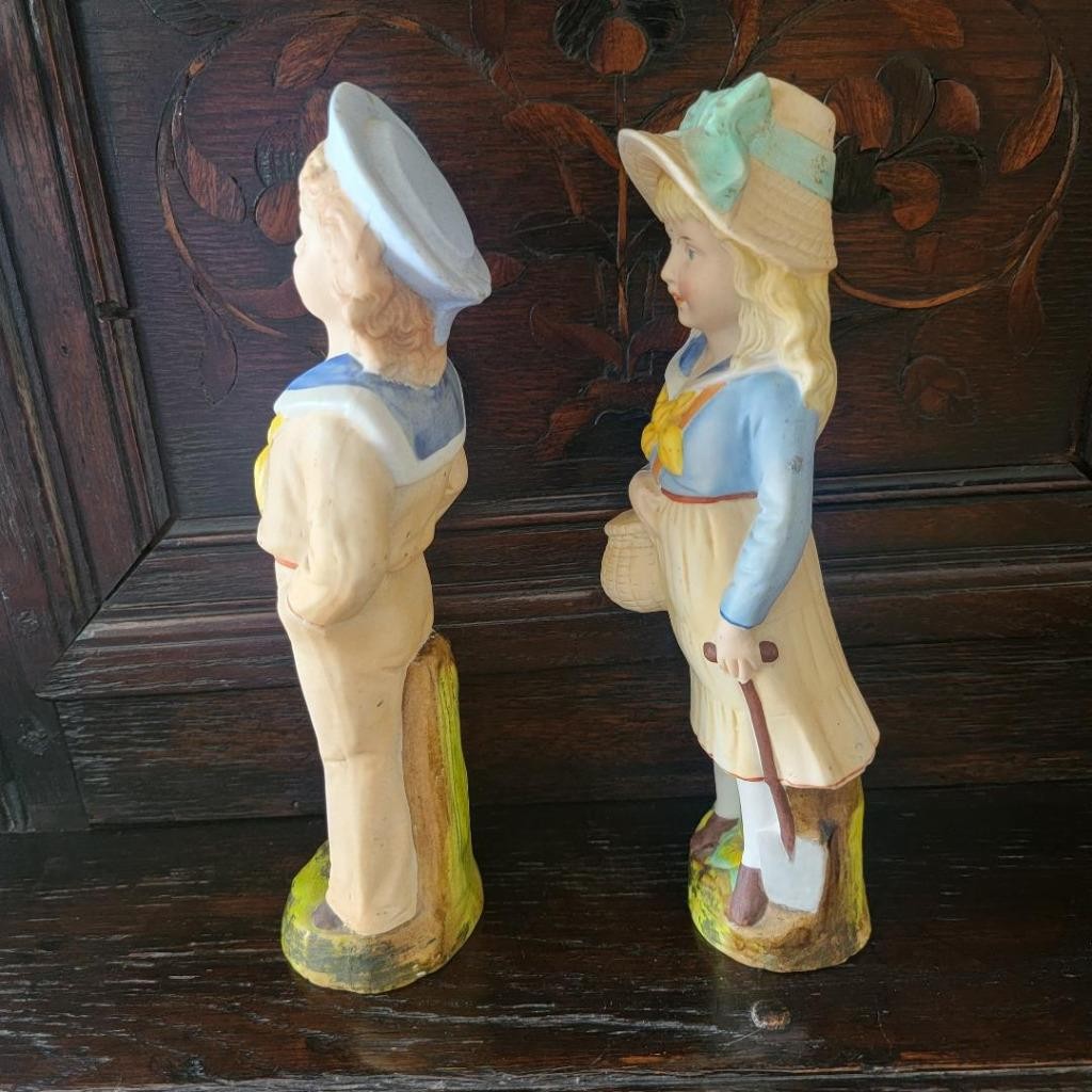 Pair Antique Hand Painted Hollow Boy and Girl Bisque Porcelain Figurines