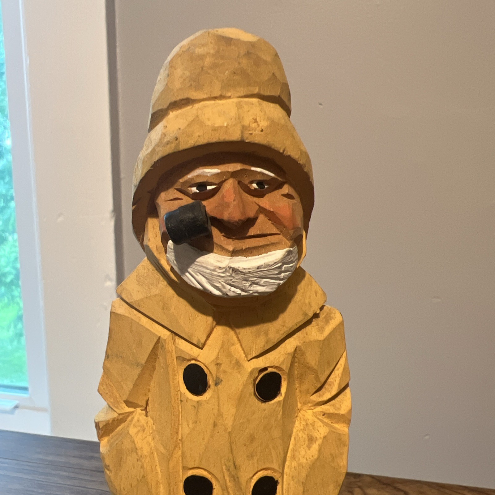 Hand-carved wooden folk-art figure of a fisherman