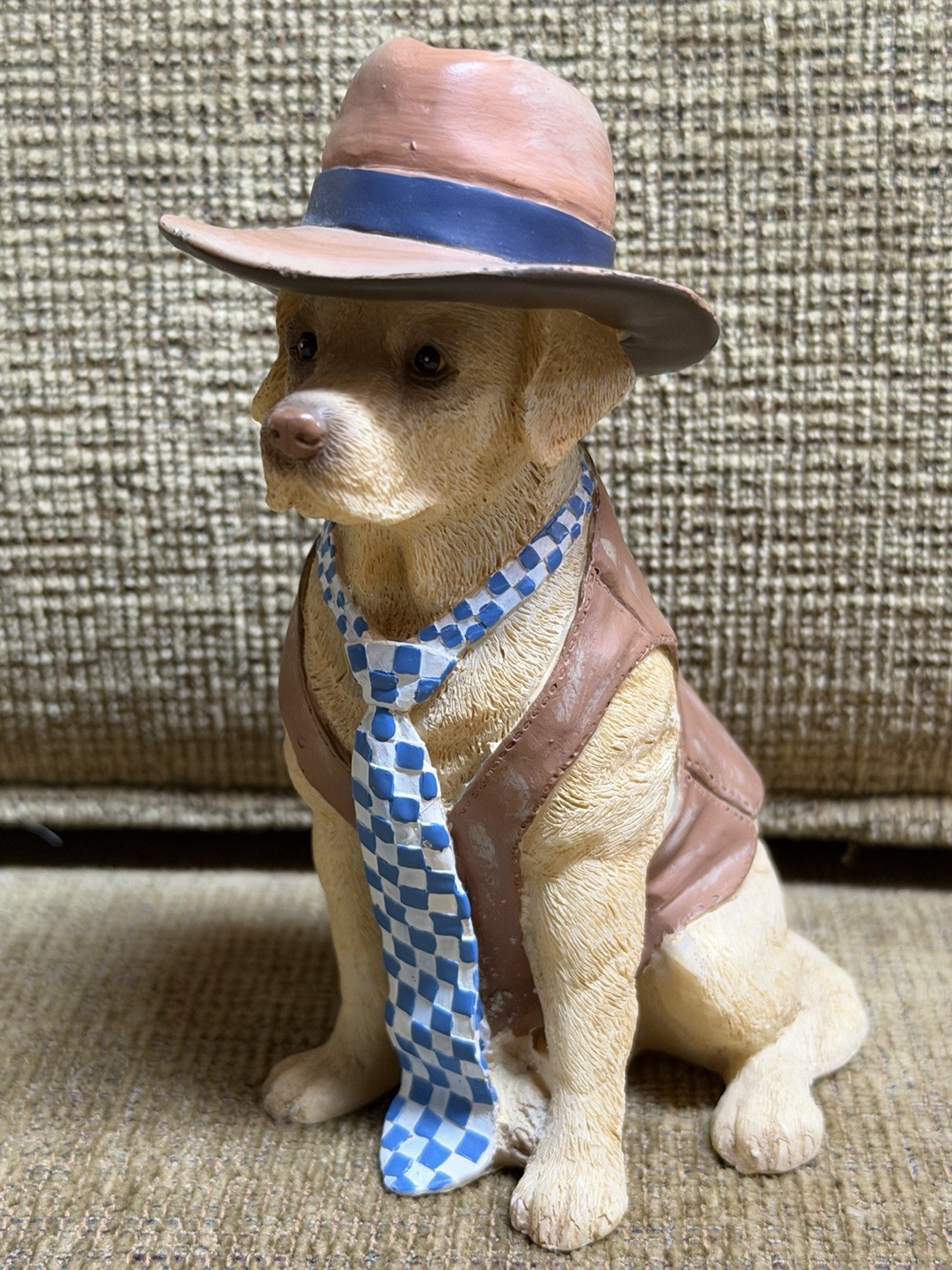 lifelike dog figurine in clothes