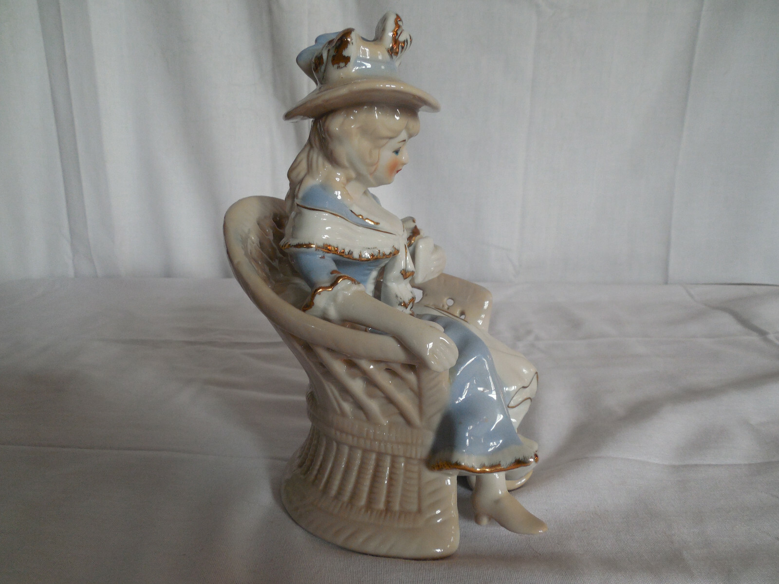 Vintage blue porcelain lady sitting in chair figure 7.5″