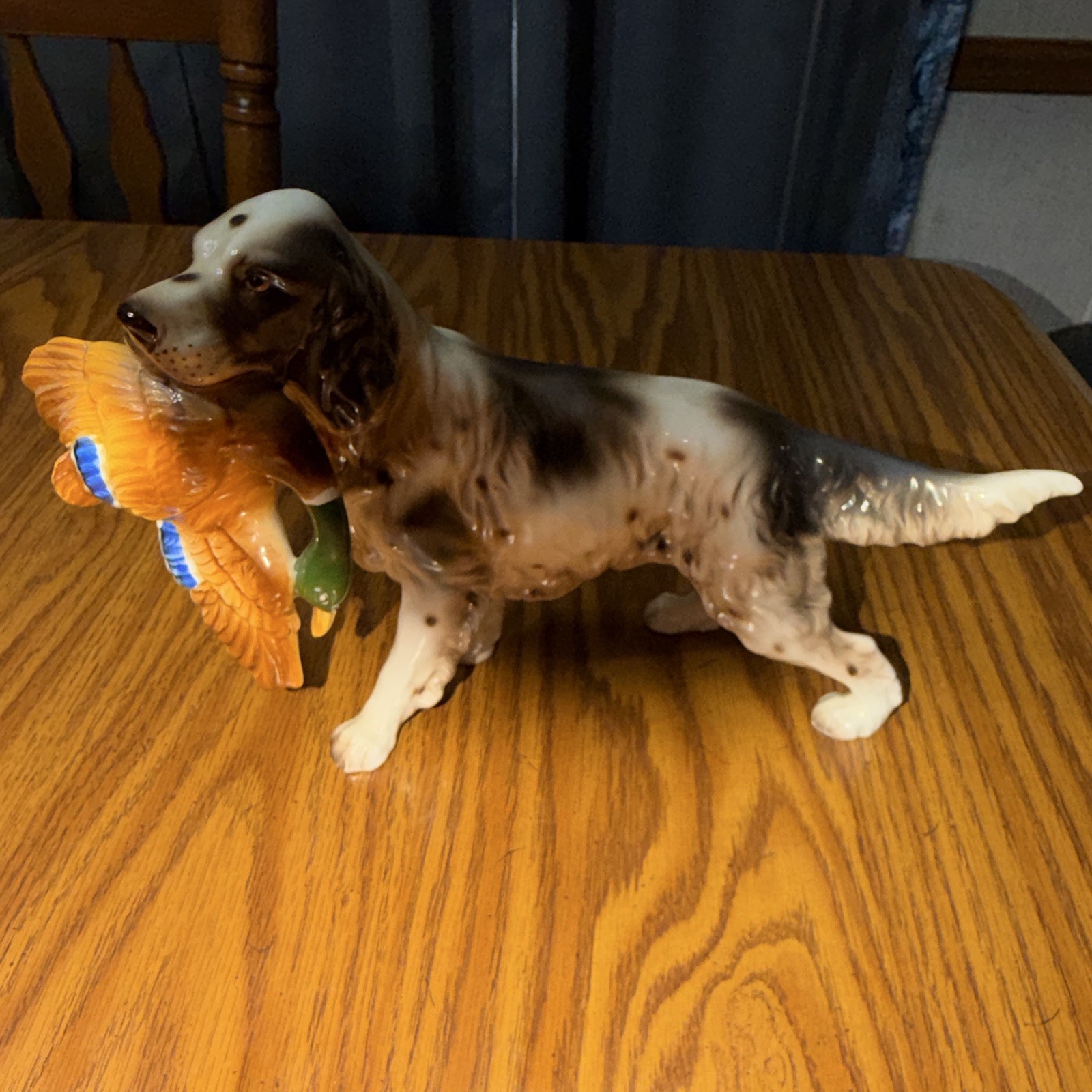 Hand Painted Glossy Ceramic Spaniel Dog Figurine Holding Bird, Multicolor