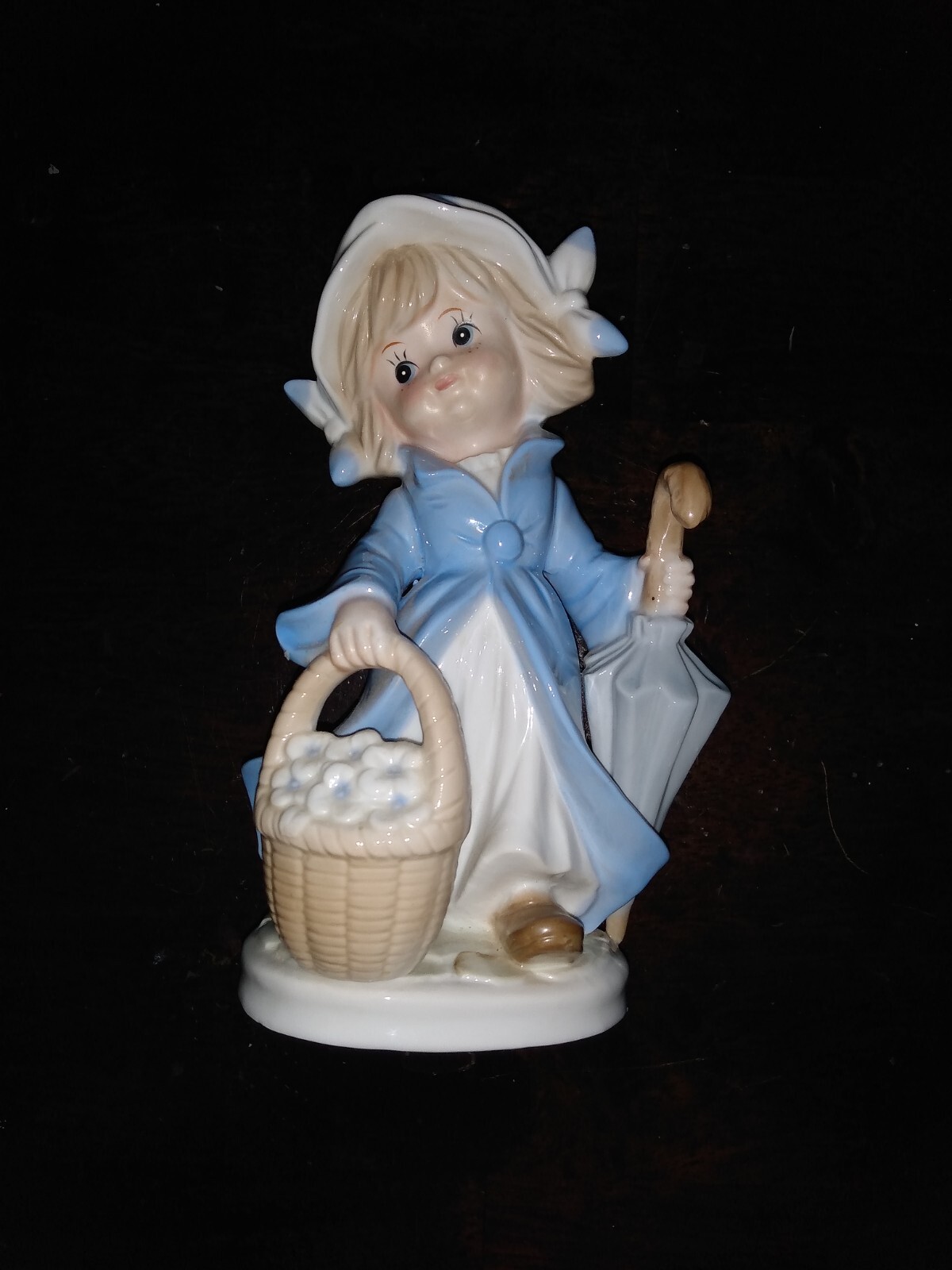 Vintage KMP porcelain girl figurine 7 7/8 inch with umbrella and basket.
