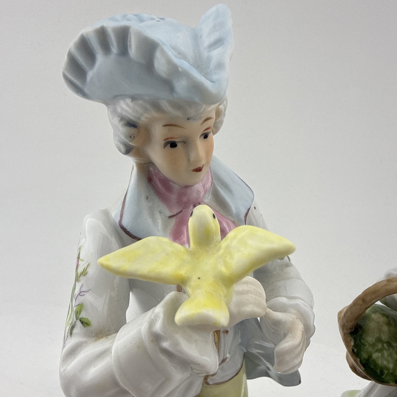 Vintage Colonial Porcelain Couple Figurines Man Bird Woman Basket