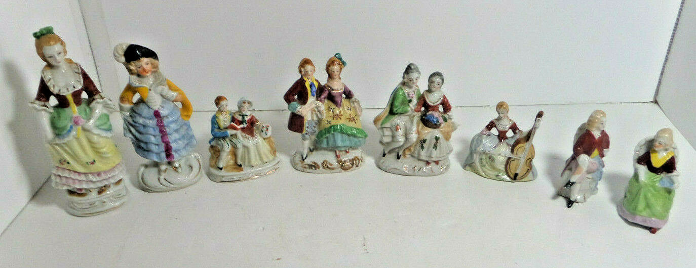 8 victorian man and women occupied Japan figurines