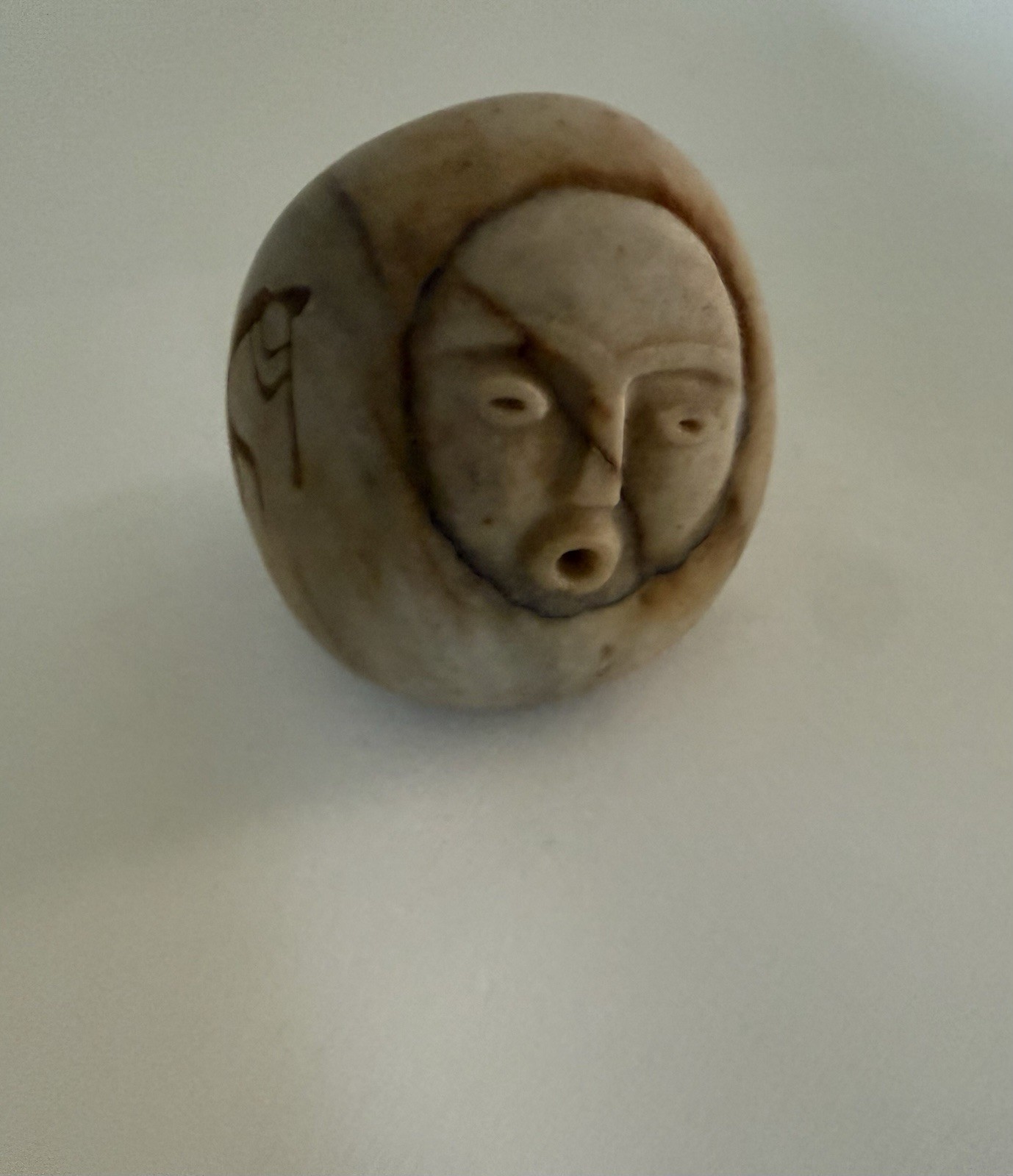 Carved Stone with Face and Kokopelli Figure Sculpture