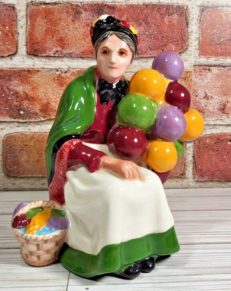 Old Balloon Seller Ceramic Figurine