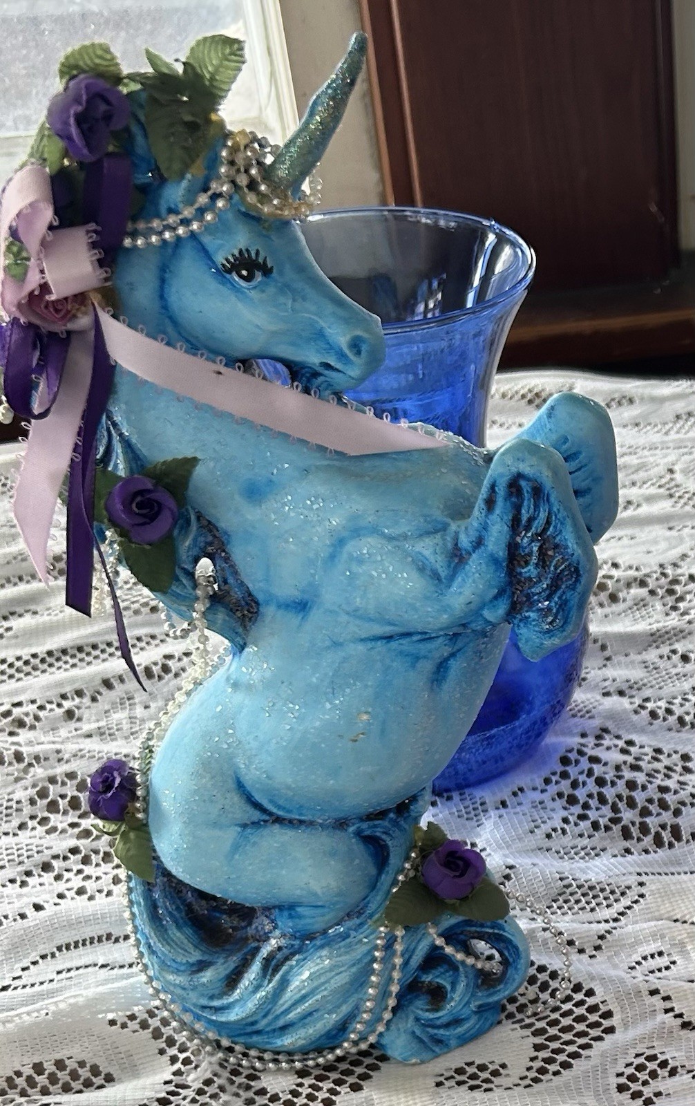 Ceramic decorative collectible figurine of a blue unicorn