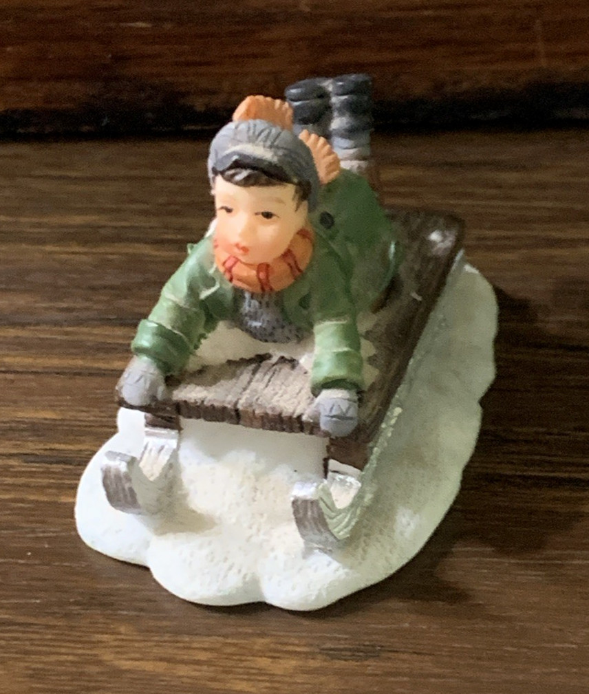 Boy Sleigh Riding Figurine Christmas