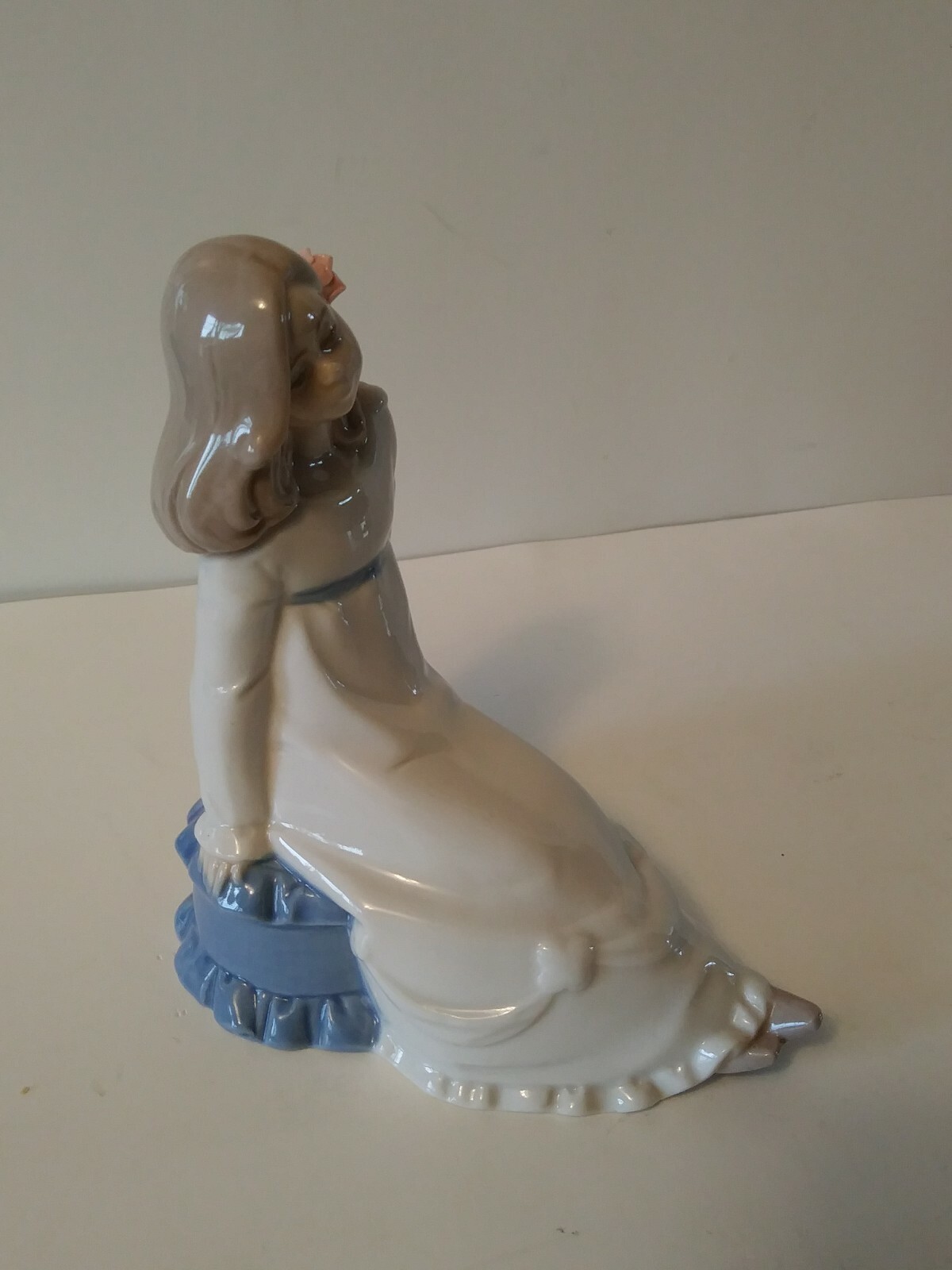 Enrique Nadal Porcelain Girl Sitting on a Cushion Figurine 1987 Excellent shape.