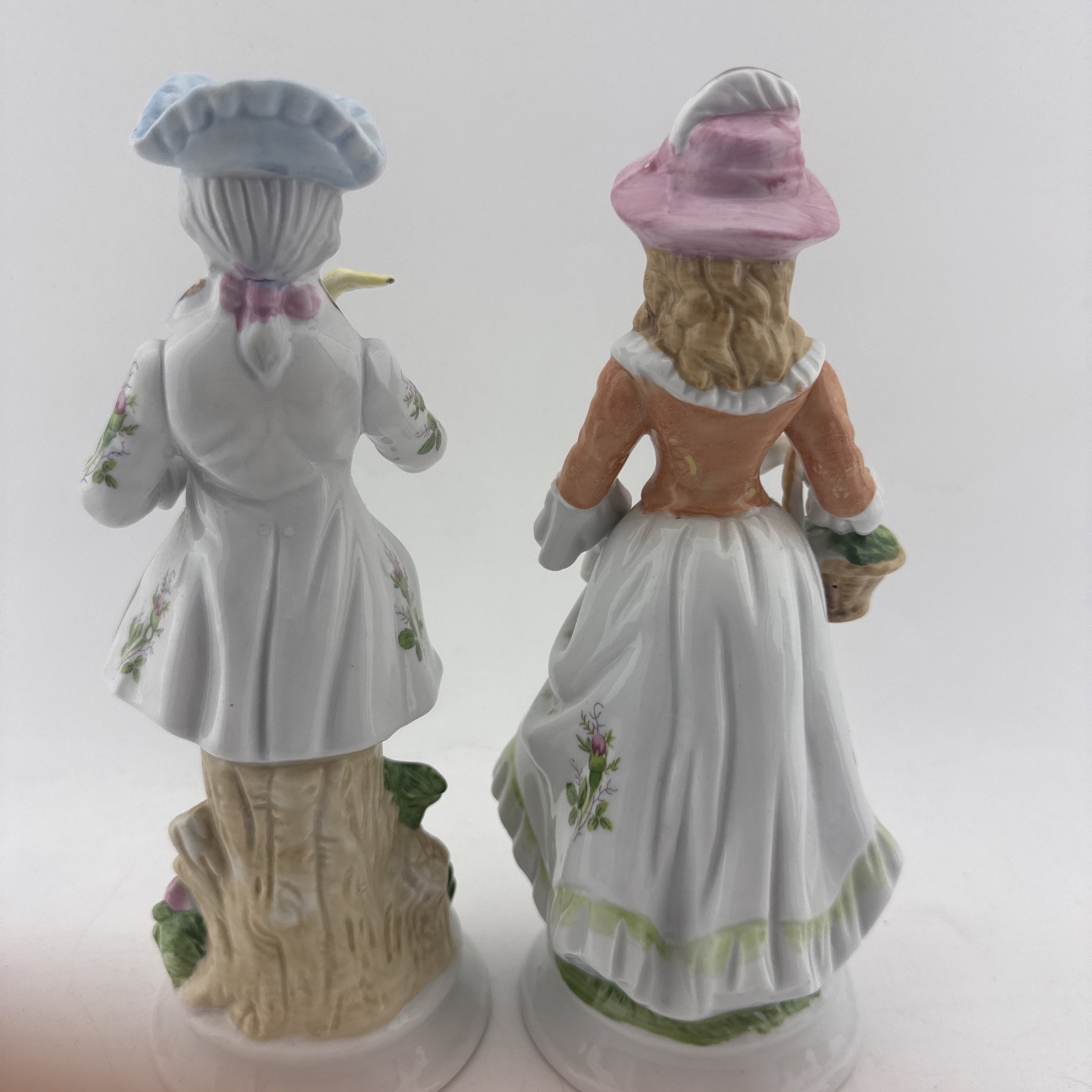 Vintage Colonial Porcelain Couple Figurines Man Bird Woman Basket