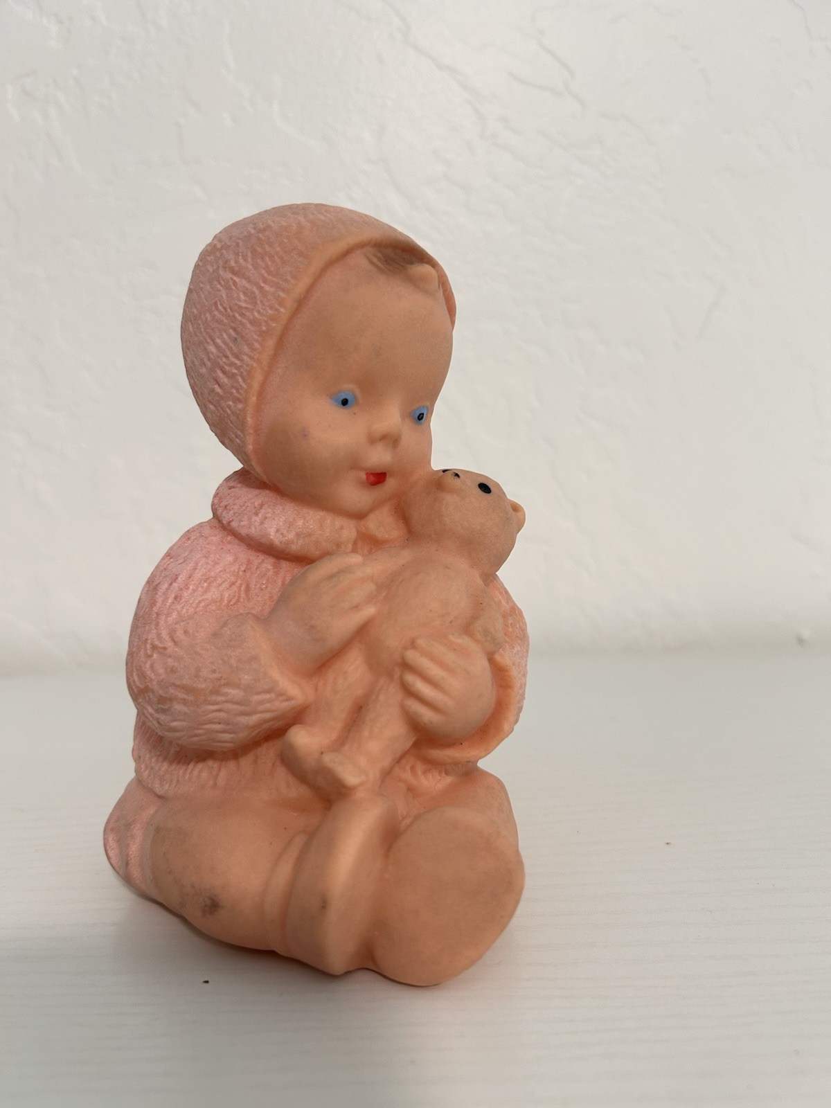 Mid 20th century model molded rubber baby figurine with teddy bear 6” height