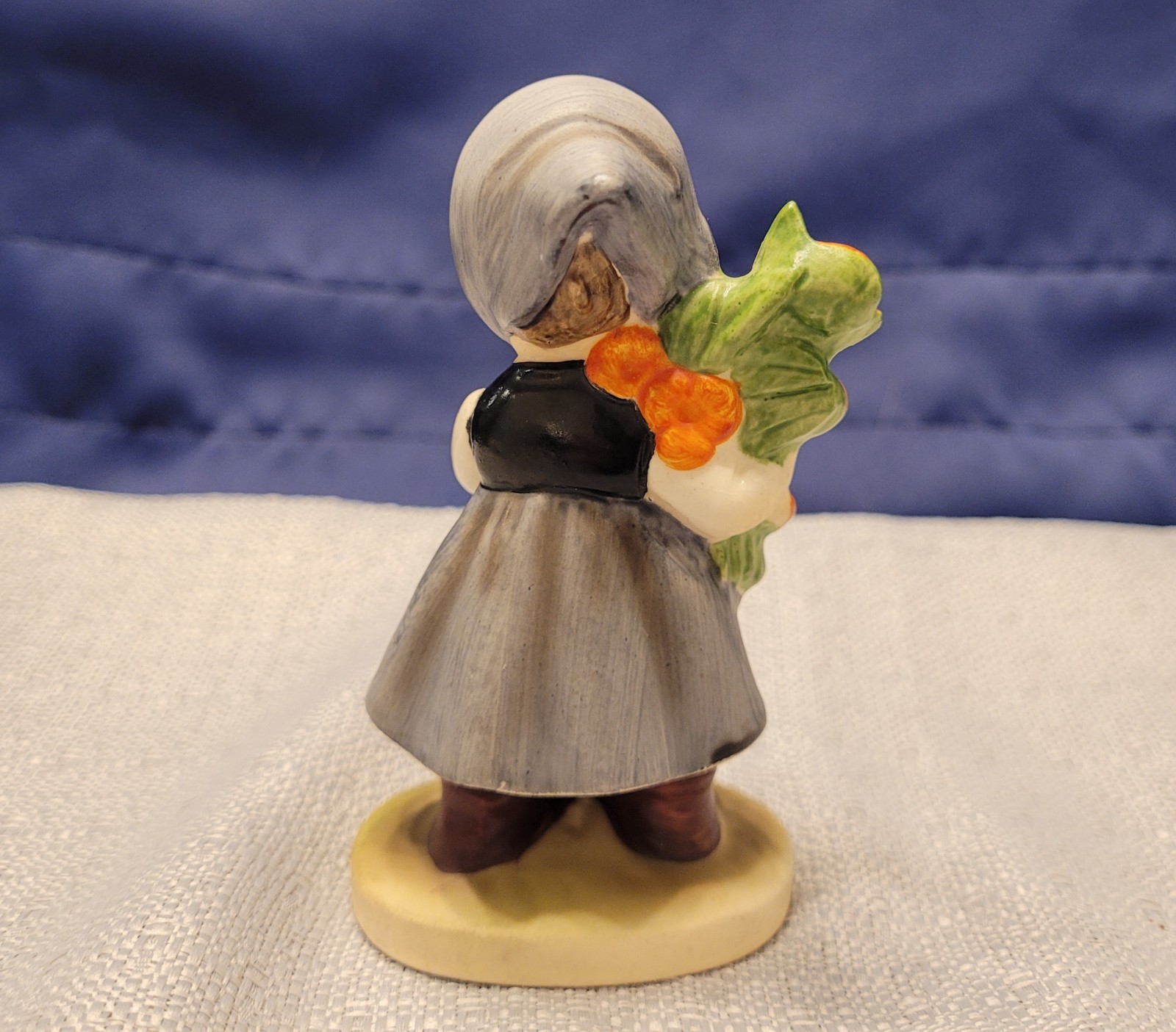 Napcoware Little Girl Holding Flowers #07653