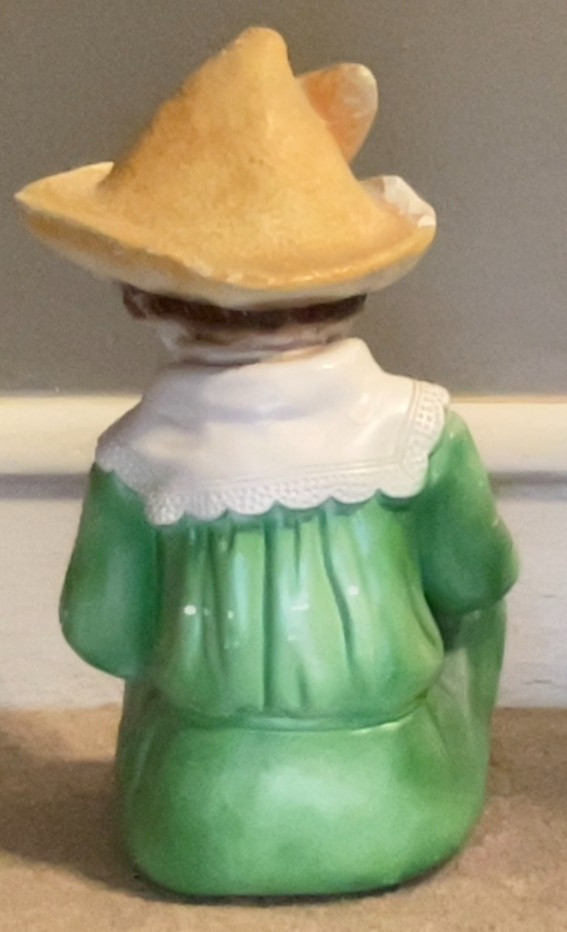 Large Ceramic or Chalk Figurine. Young Boy Holding an Apple. 12″ x 7″.
