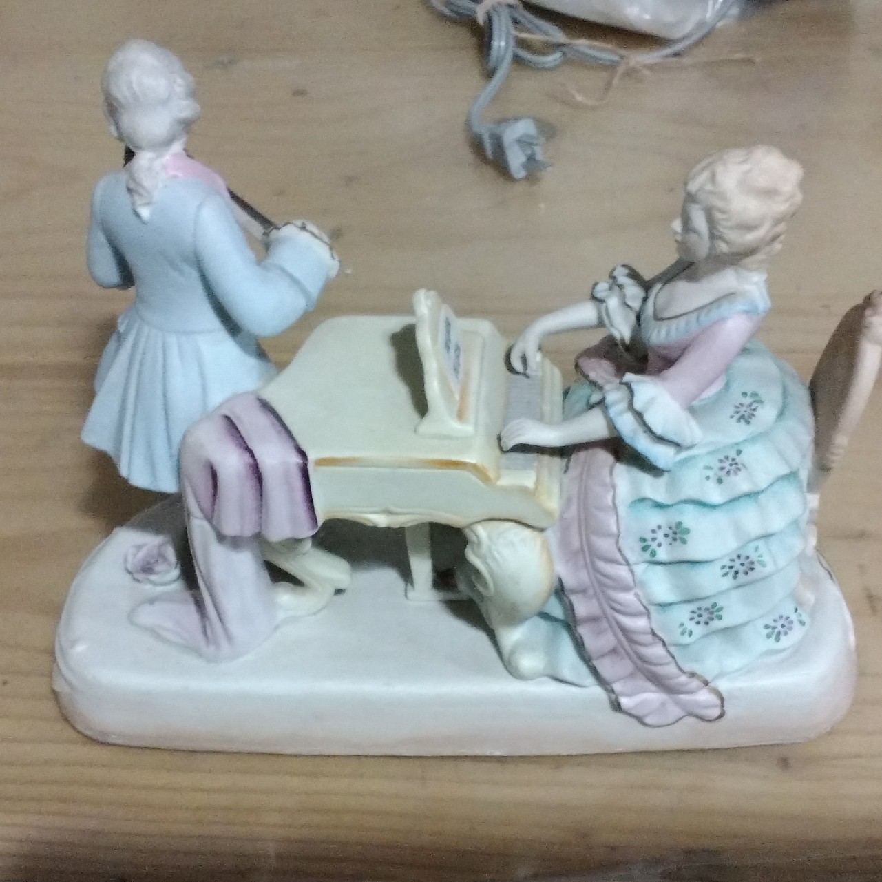 Hand painted bisque figurine couple playing music