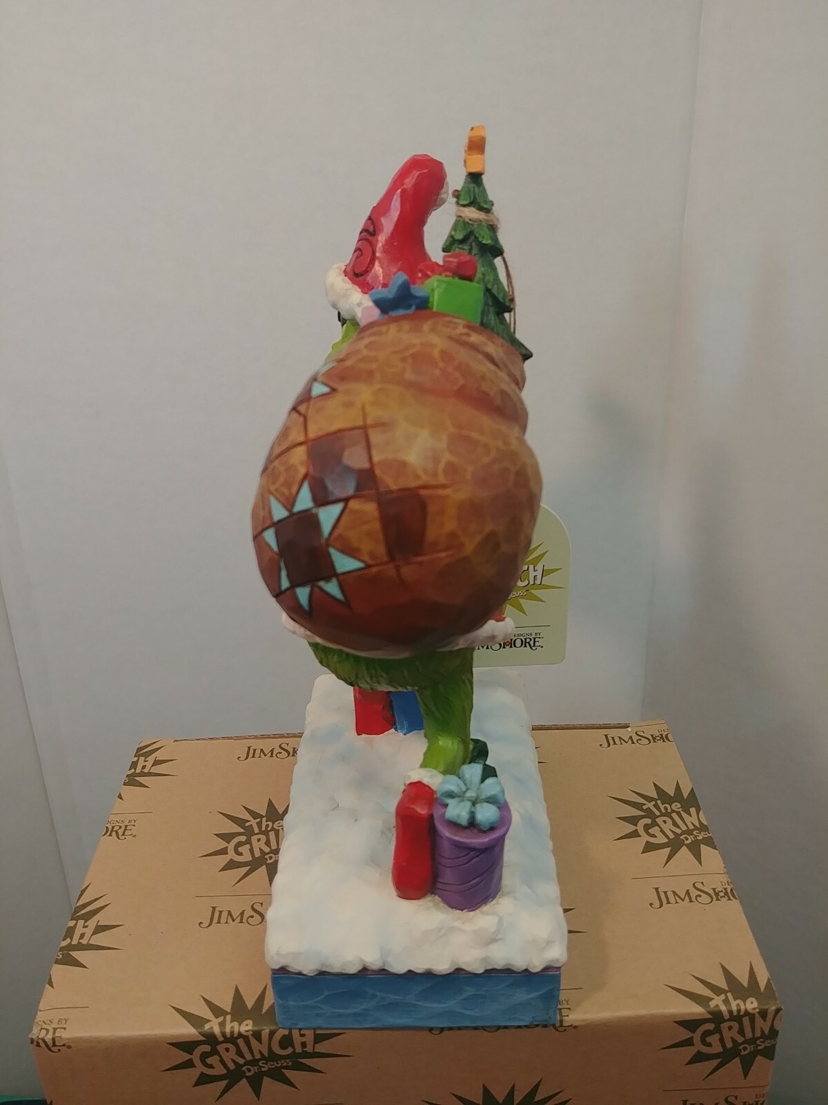 Dr. Seuss Grinch by Jim Shore Grinch Tip Toeing with Bag of Gifts 7.7″ Figurine