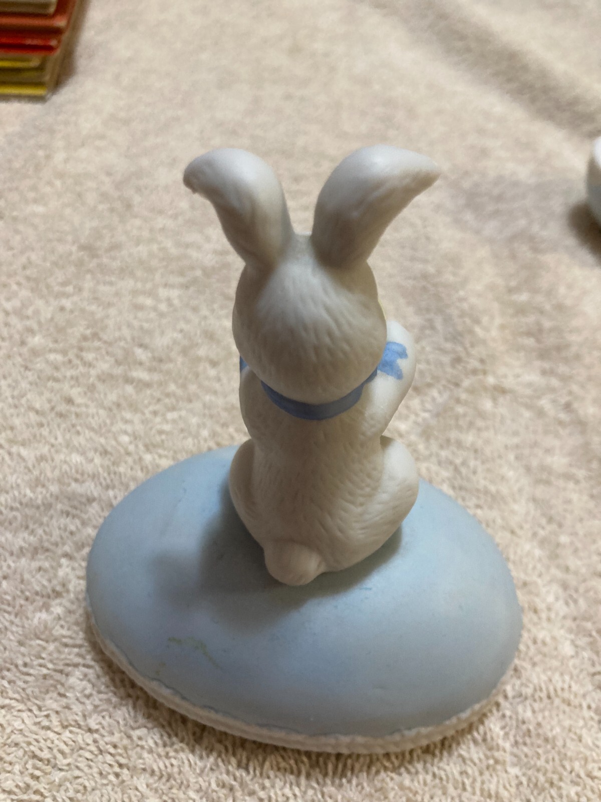 White Rabbit Holding onto Yellow +Green Egg 2 piece Egg that is Blue (Flawed)
