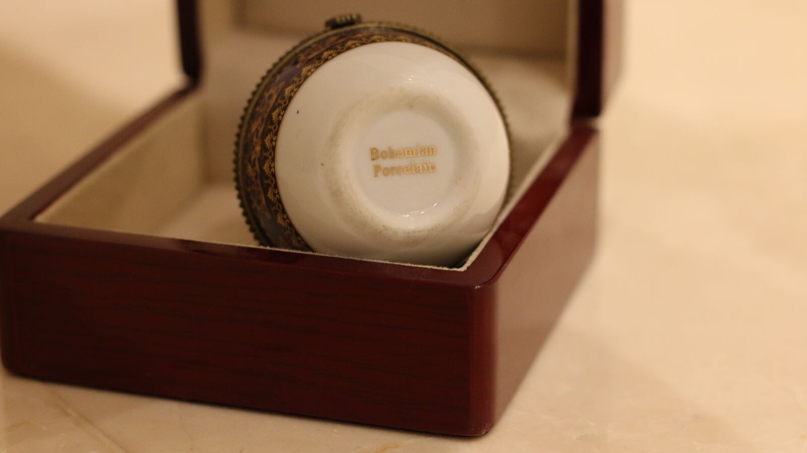 Versace Designs egg in white bohemian porcelain with blue and gold Medusa