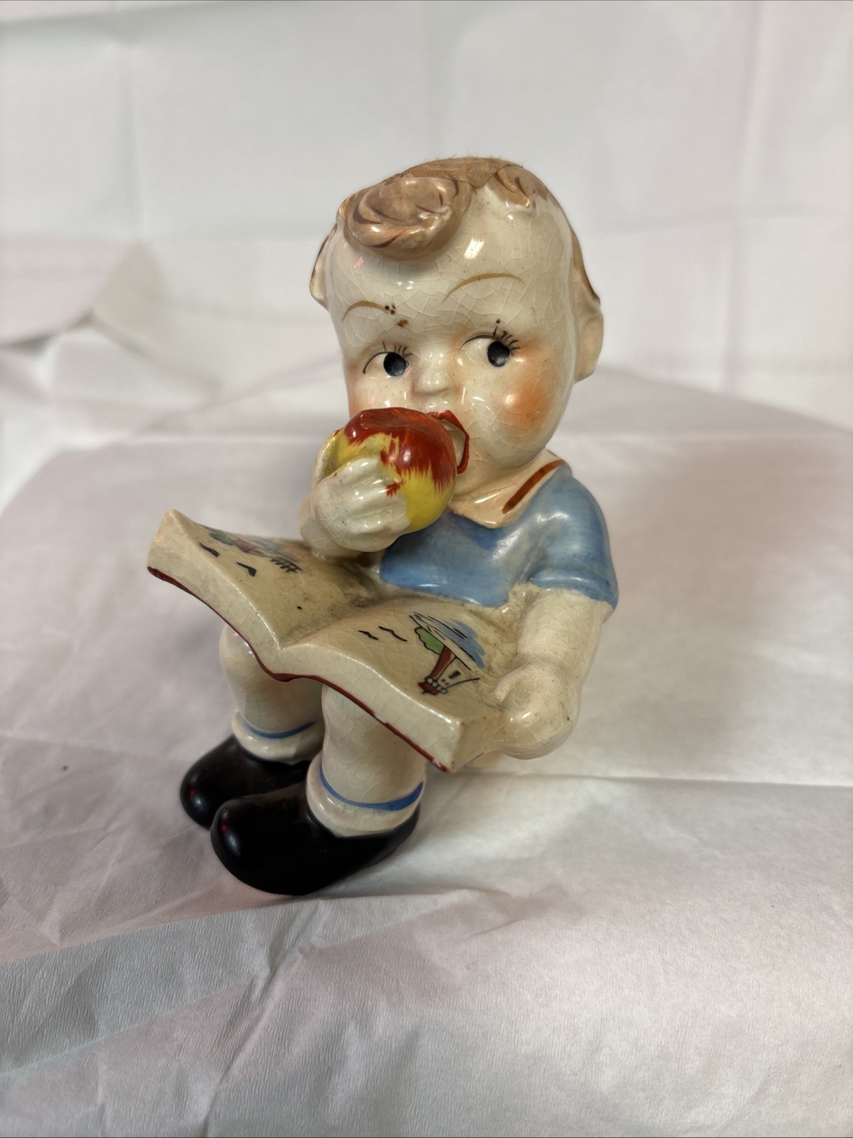 Vintage Boy Eating An Apple With Book Statue