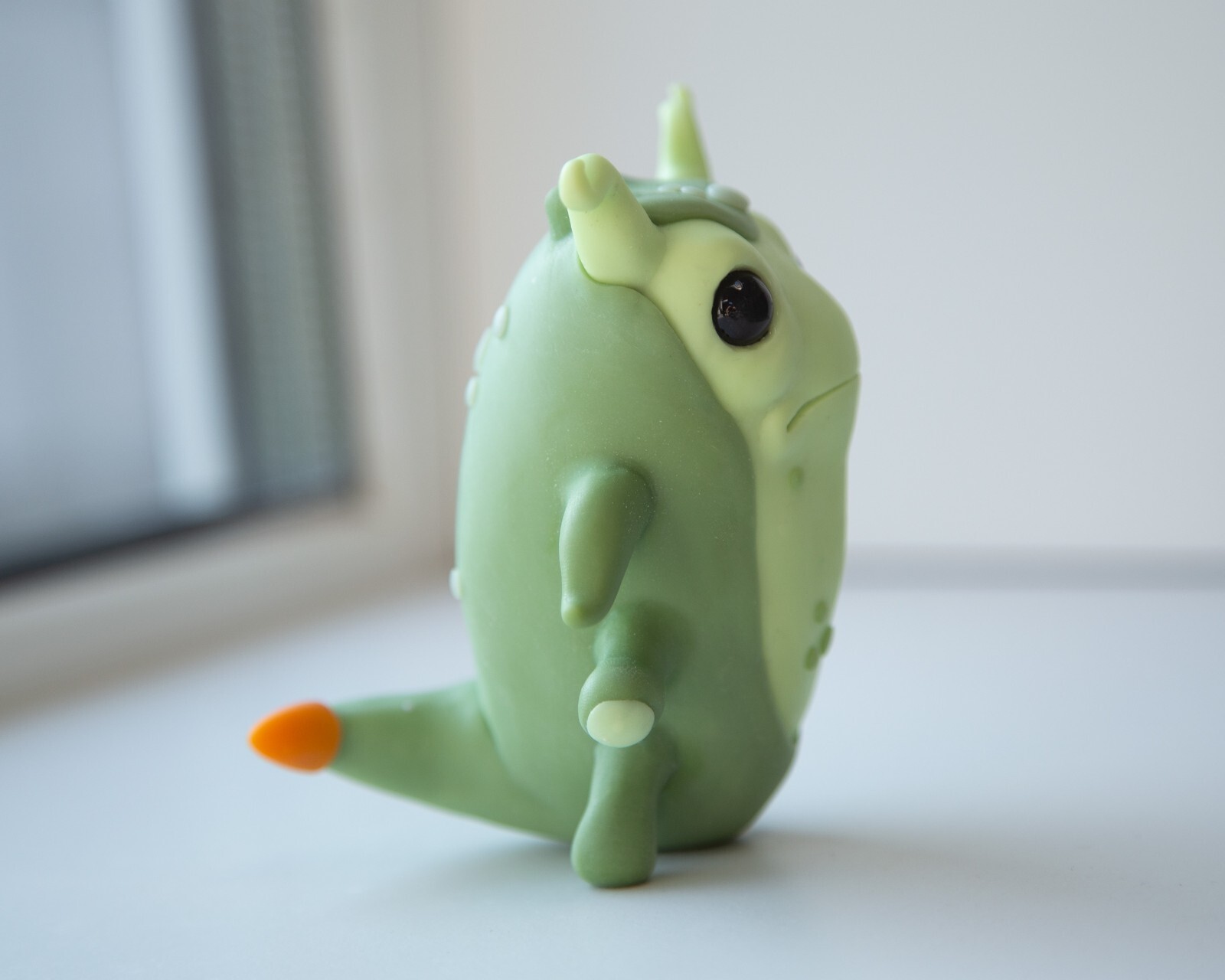 Cool and weird Germ Microbe figurine in anime style, polymer clay creature doll
