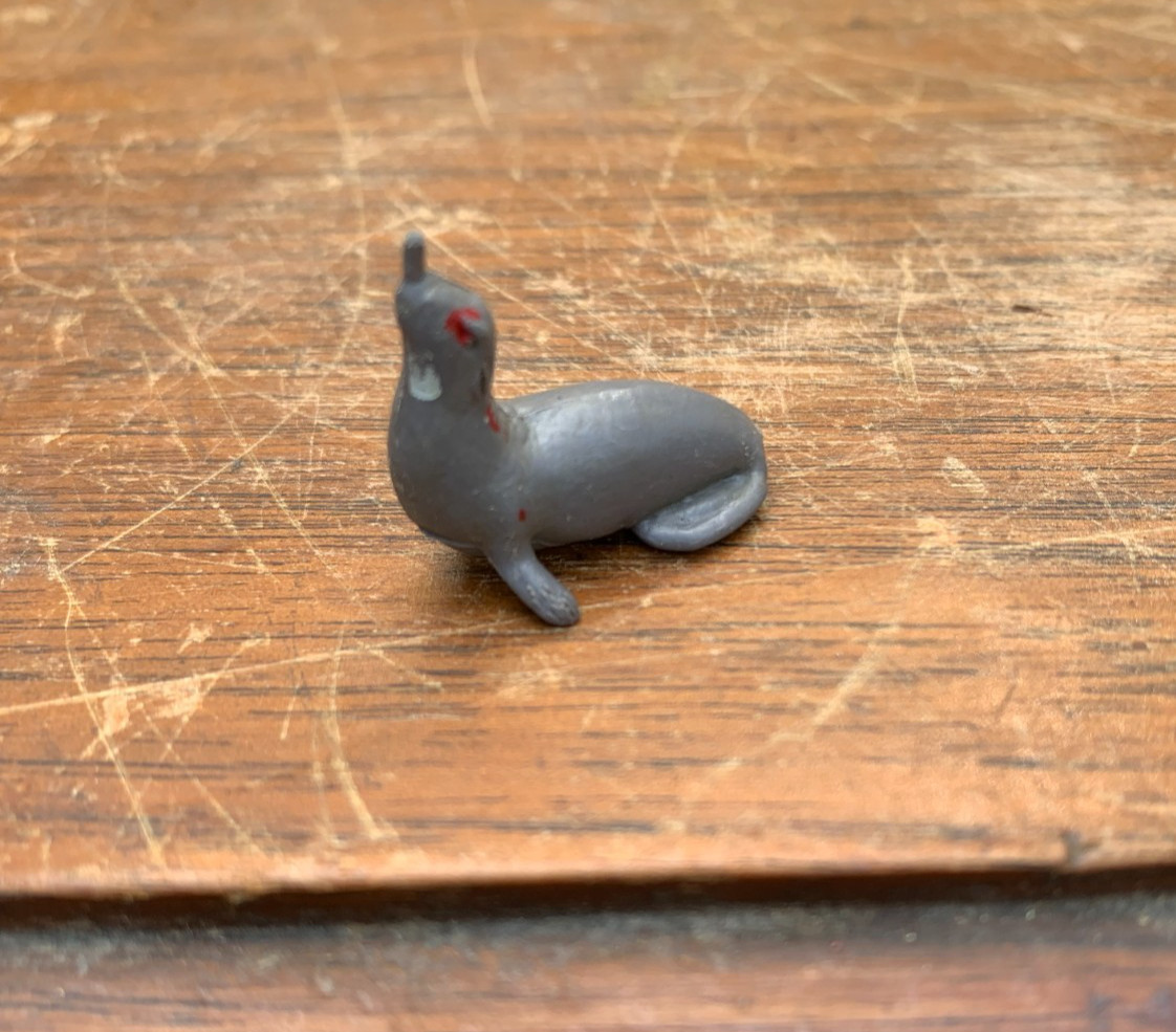 Vintage unbranded plastic toy figure of a seal or sea lion gray