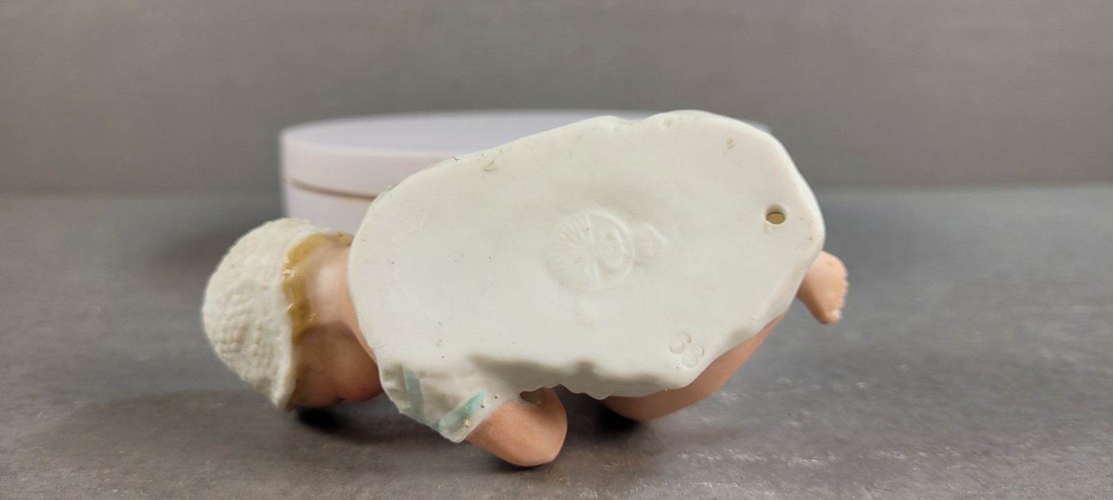 ANTIQUE GEBRUDER HEUBACH BISQUE PIANO BABY BOY W/BONNET PLAYING W/TOES 4.5″ LONG