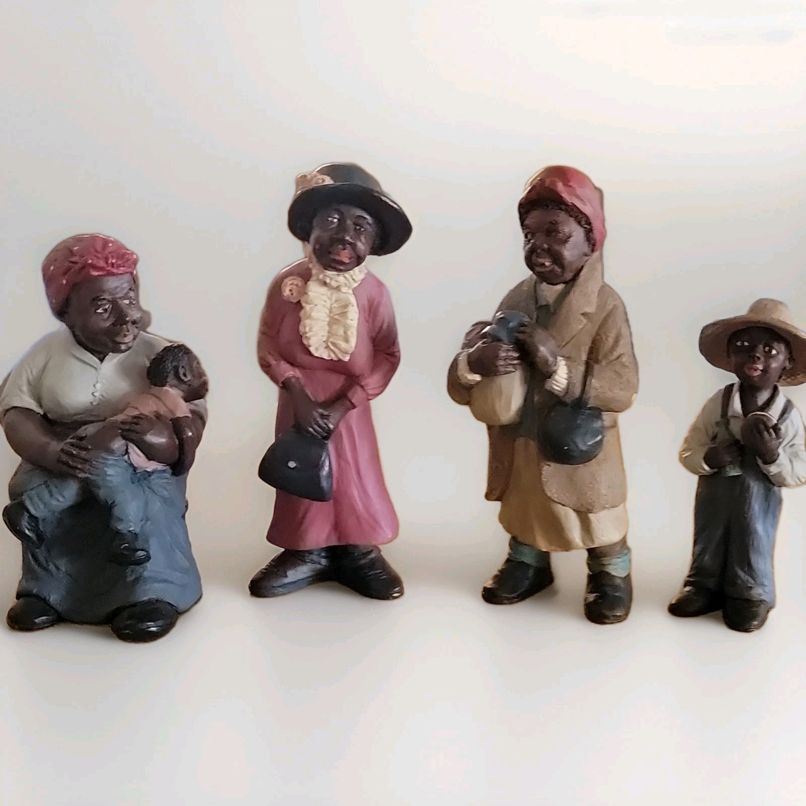 Hand Painted Resin People Figurines Lot of 4 Seated Woman, Man, Child Figures