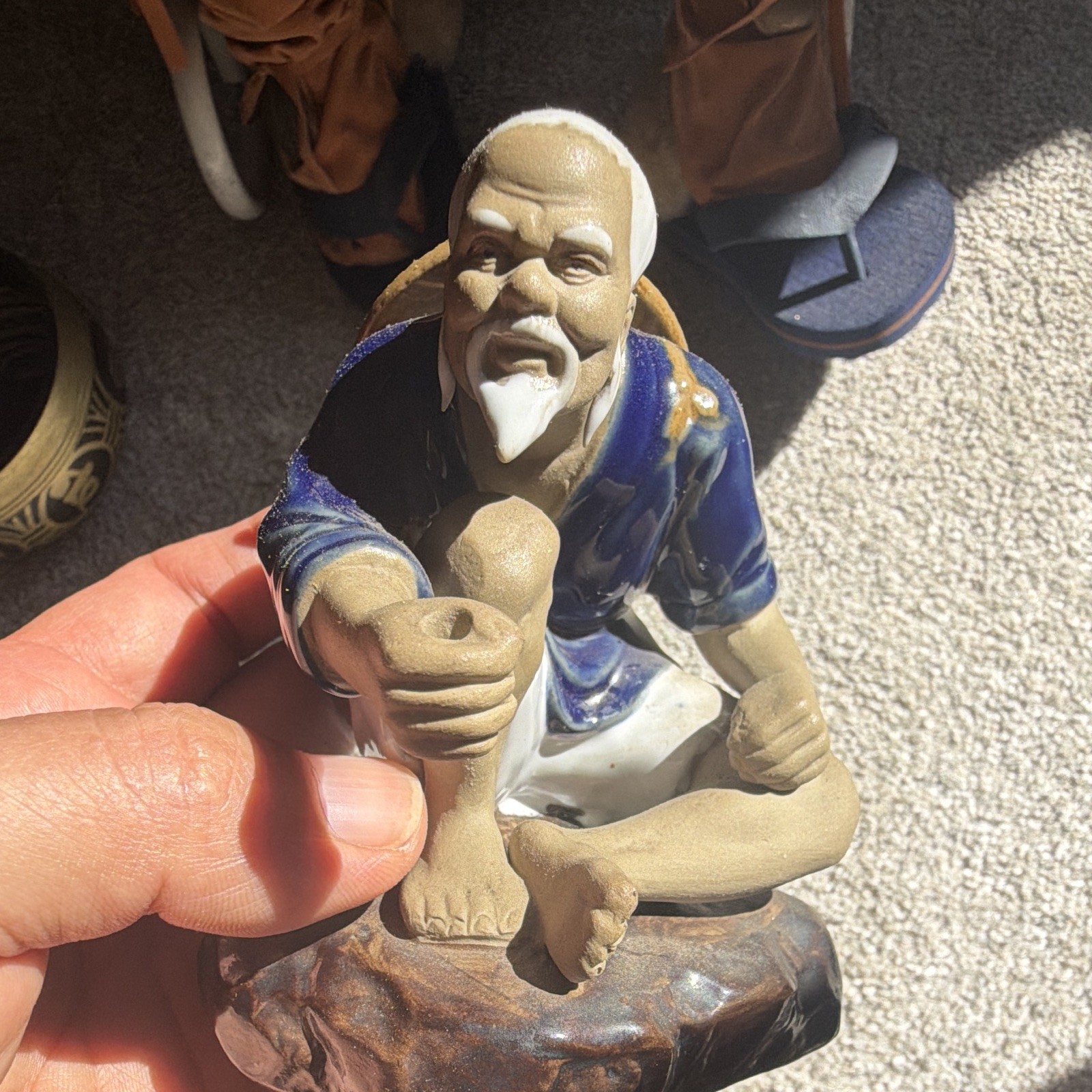 Ceramic Man Figurine Seated Blue Robe Hat Painted Finish Blue Beige Brown